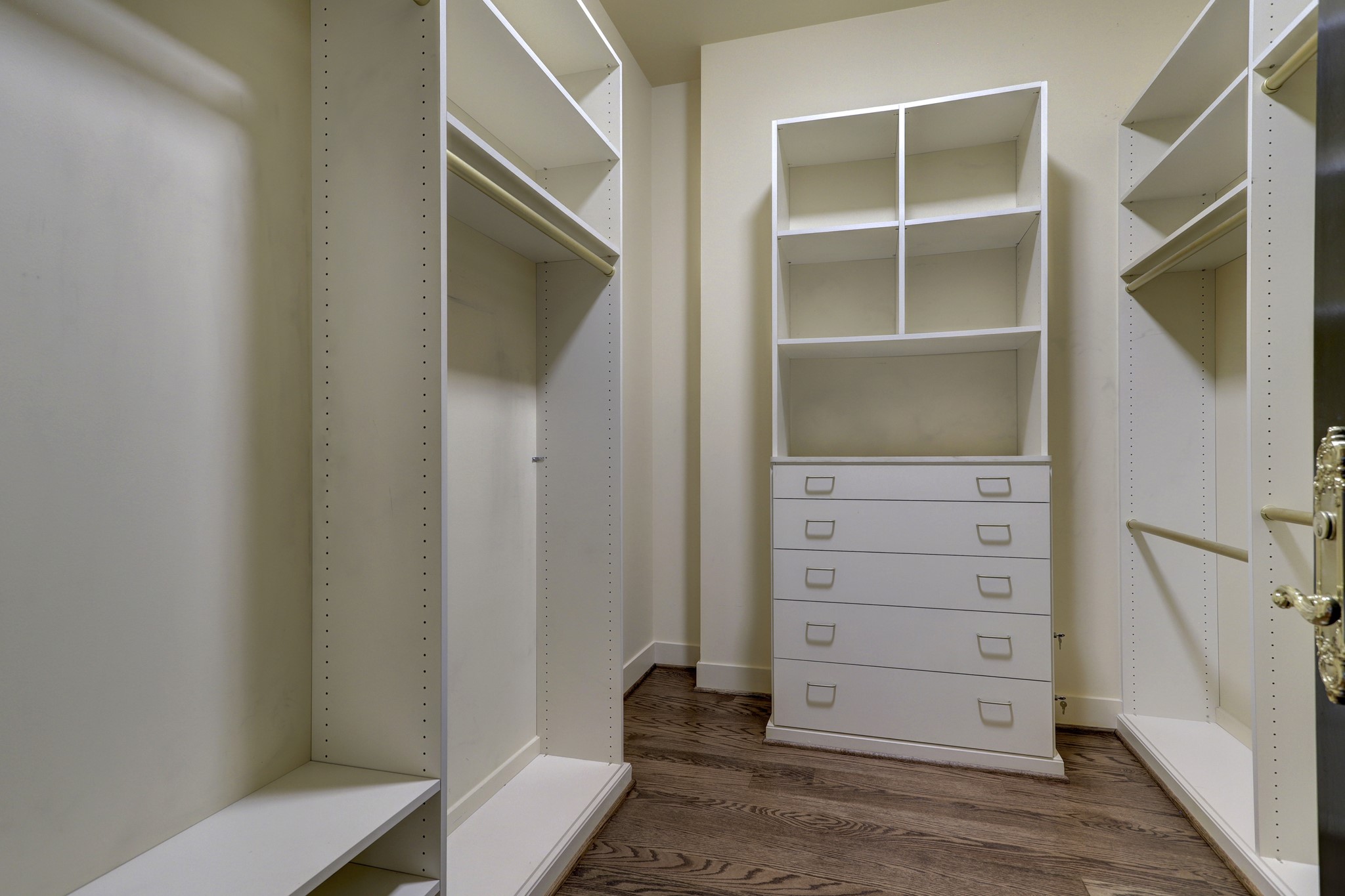 The second of two large custom designed walk-in closets in the Primary Bedroom offering plenty of storage.