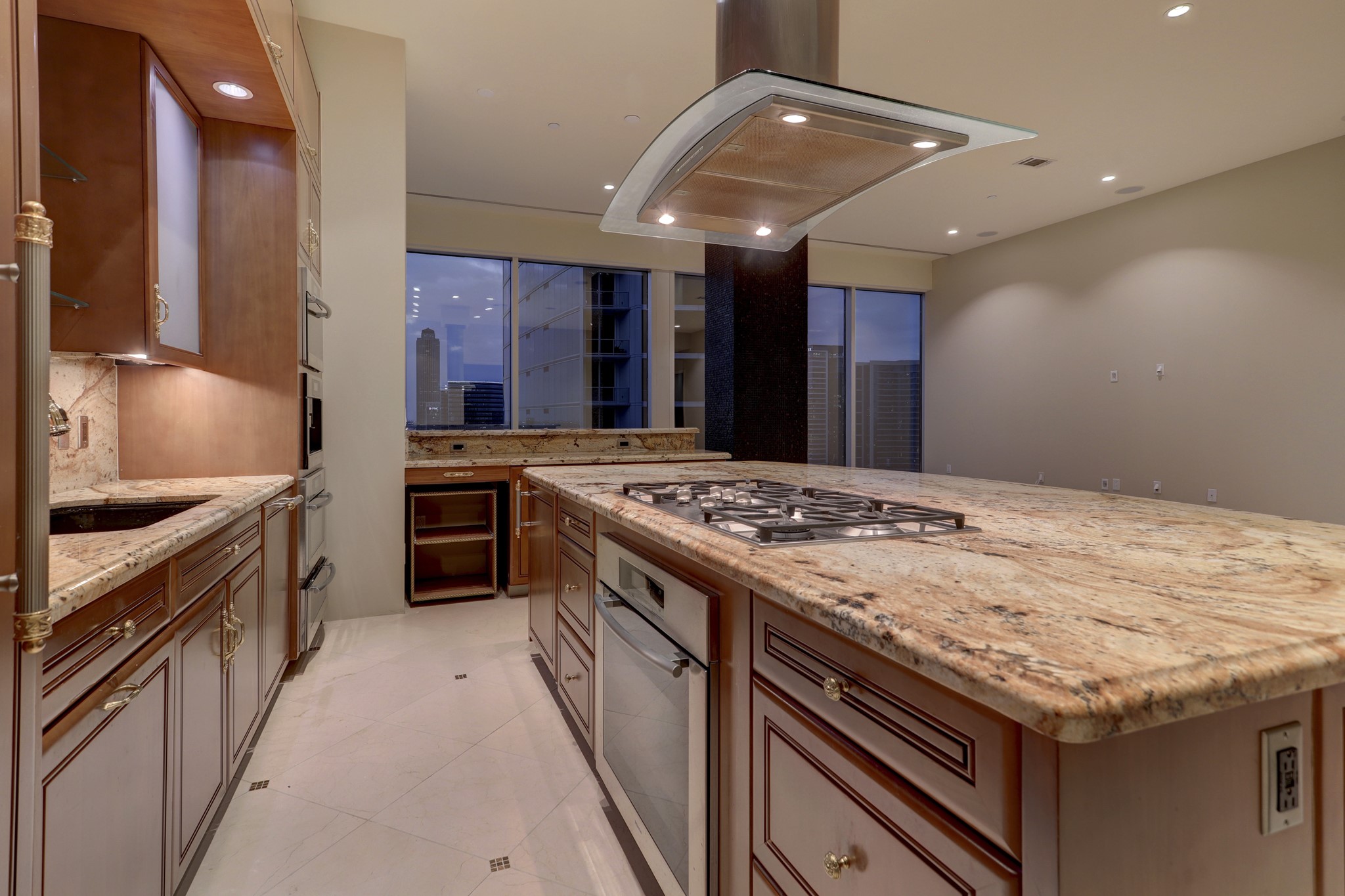 The Kitchen offers ample storage cabinets and drawers, prep space and under counter refrigerator.