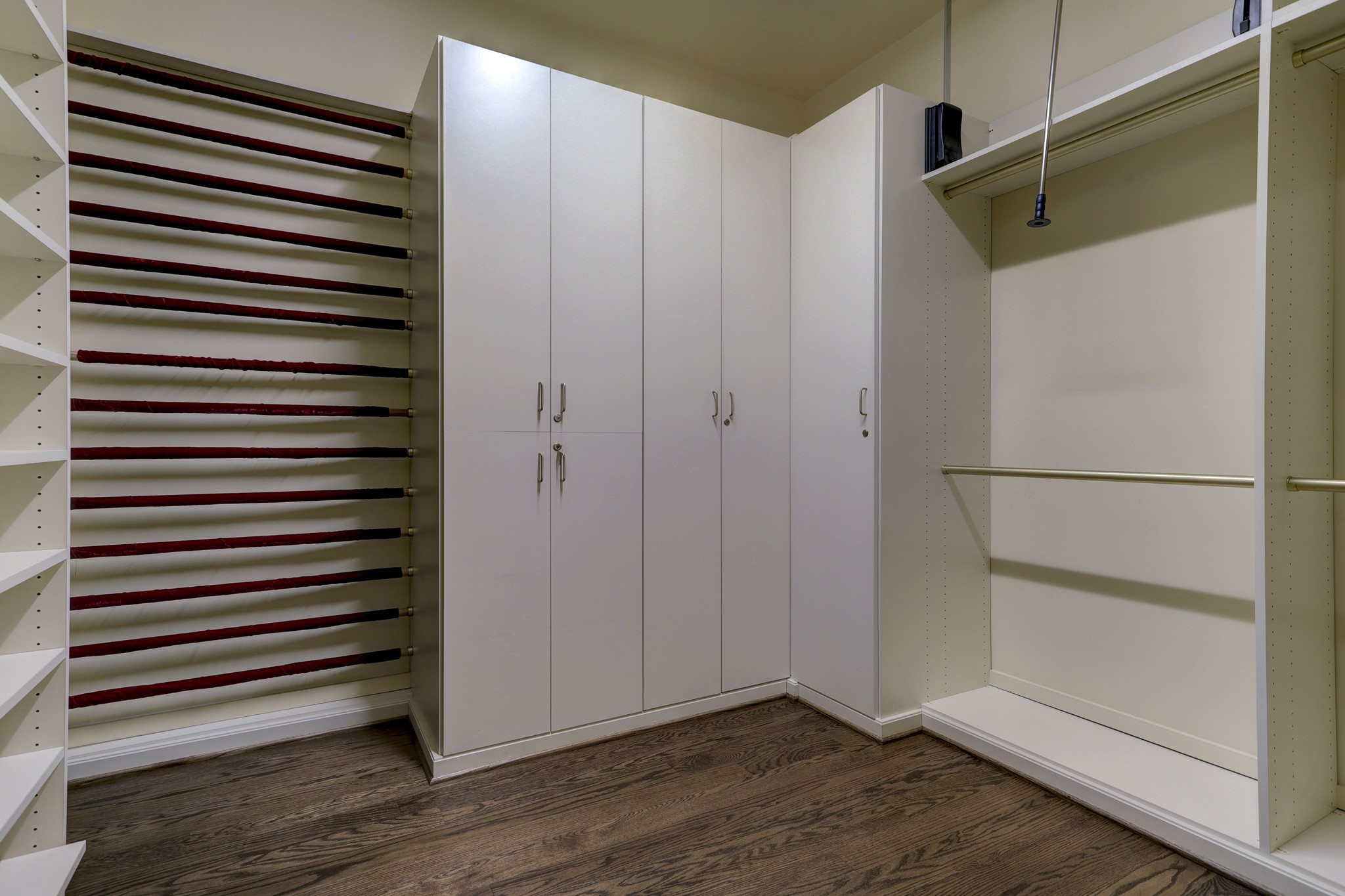 One of two large custom designed walk-in closets in the Primary Bedroom offering plenty of hanging space for all sizes.