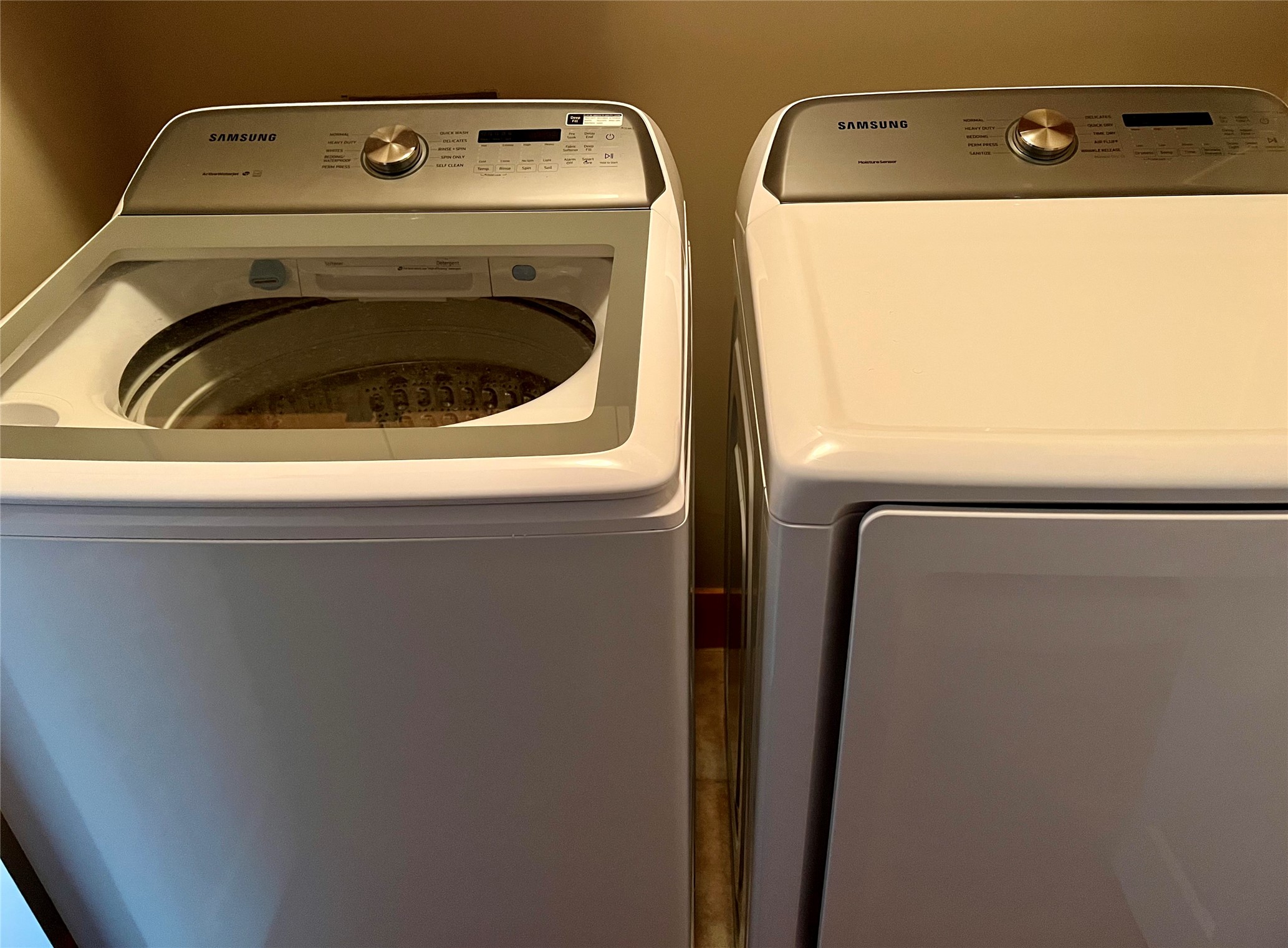 Utility room with Samsung washer and dryer, located on the third floor.