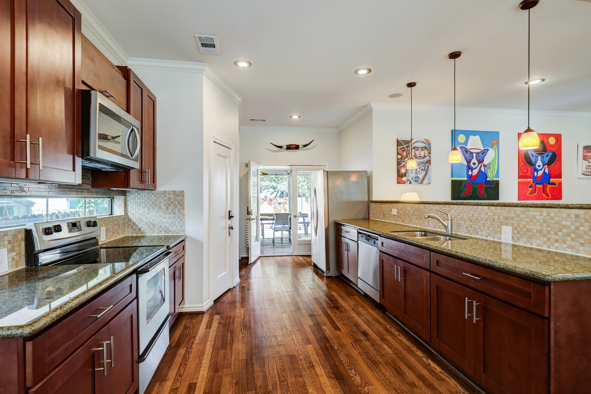 The large kitchen is open to the family room and allows convenient access for entertaining indoors or out.