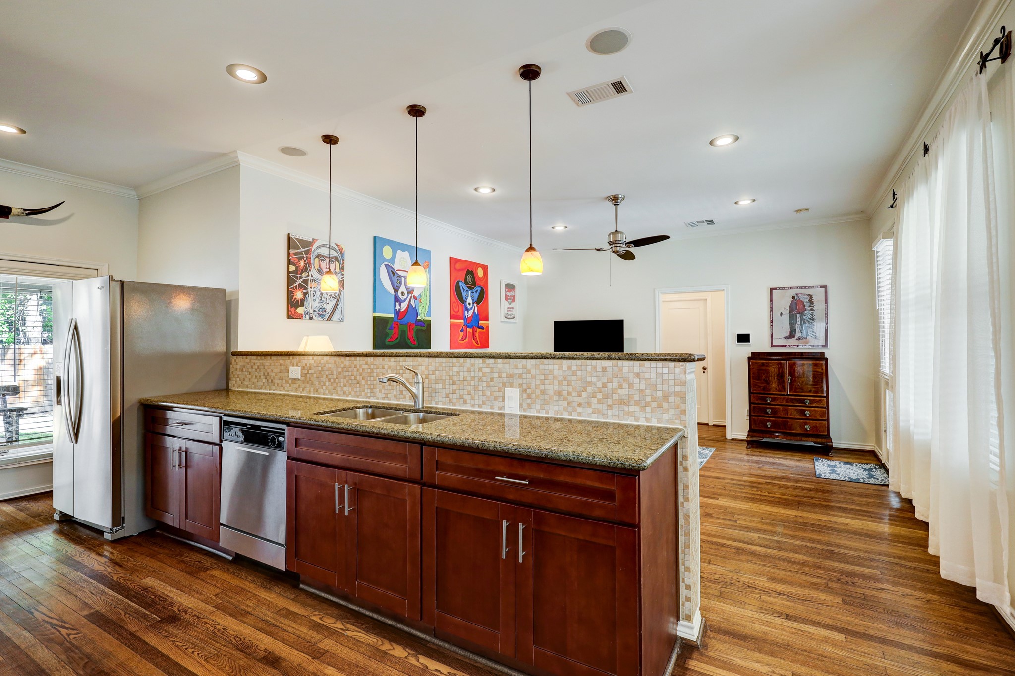 The spacious kitchen features stainless steel appliances, all included with the listing.