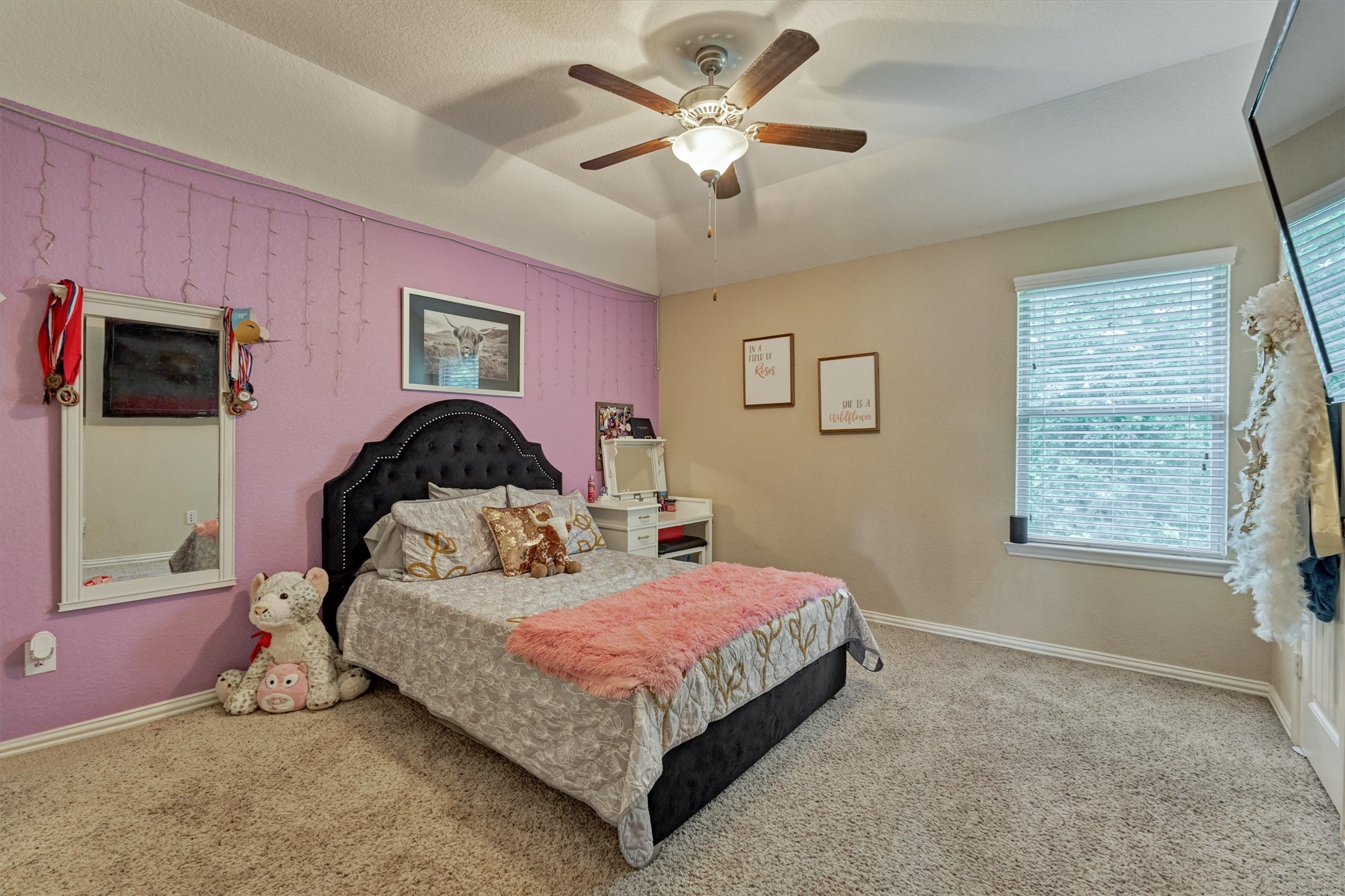 All of the bedrooms are spacious and enjoy large closets. Note the natural light, decorator colors, and upgraded ceiling fan.