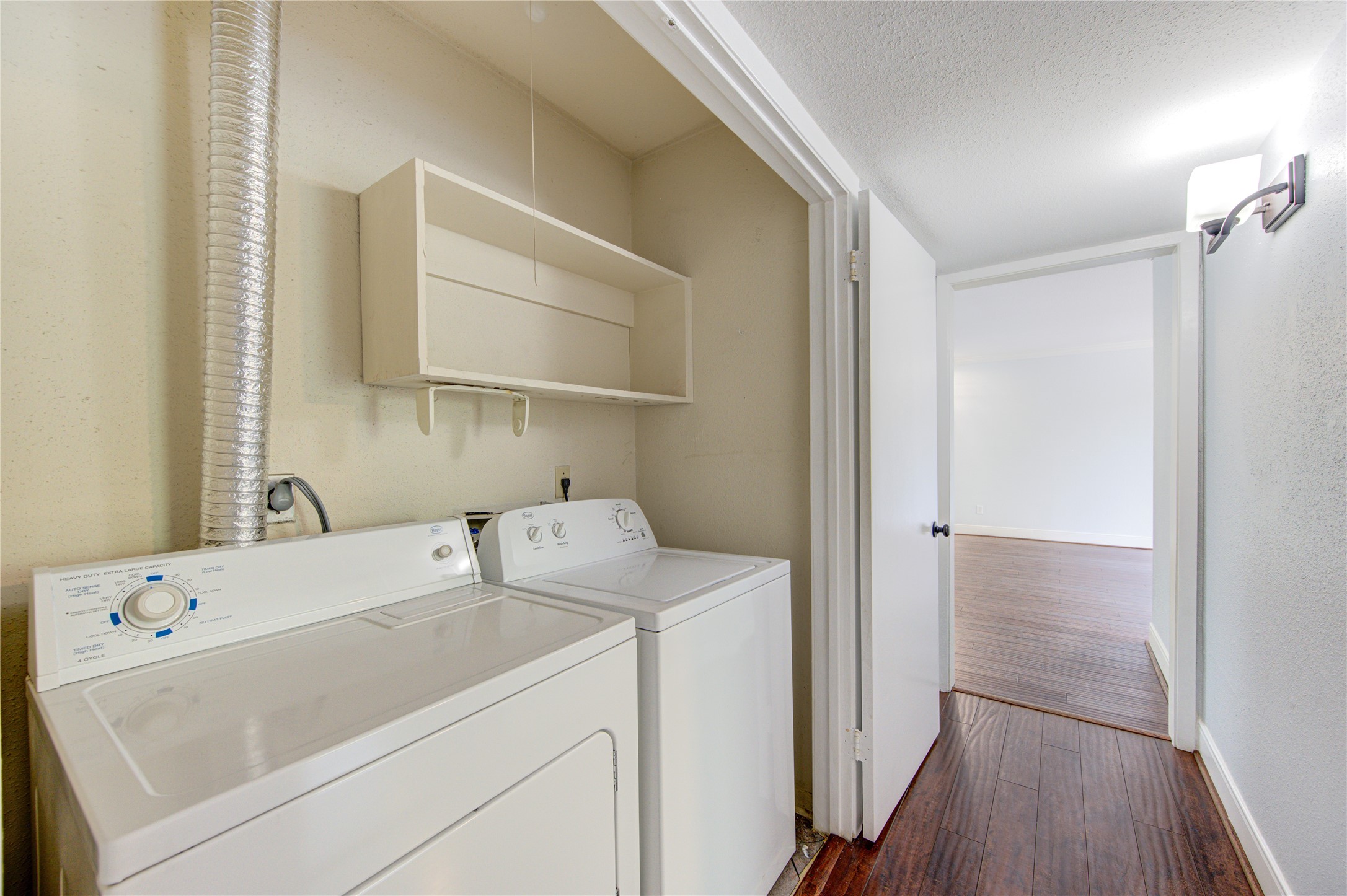 You'll find your full size washer and dryer tucked behind double doors next to the secondary bath. The washer dryer stay with the unit!