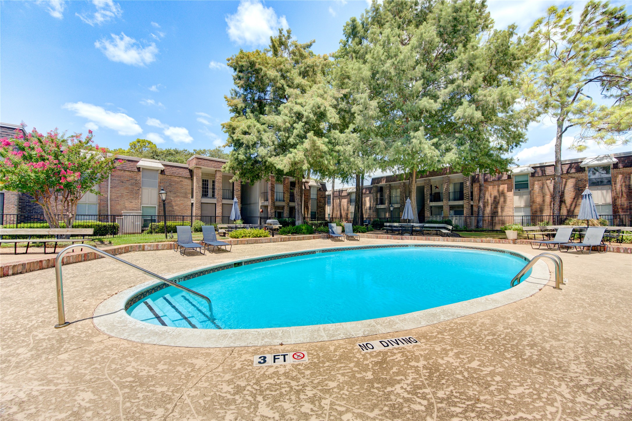 You'll love living in Bayou Woods where you'll be living amongst beautiful landscaping, have access to TWO SPARKLING POOLS, and have round the clock security! Here's a shot of the luscious second pool as well!