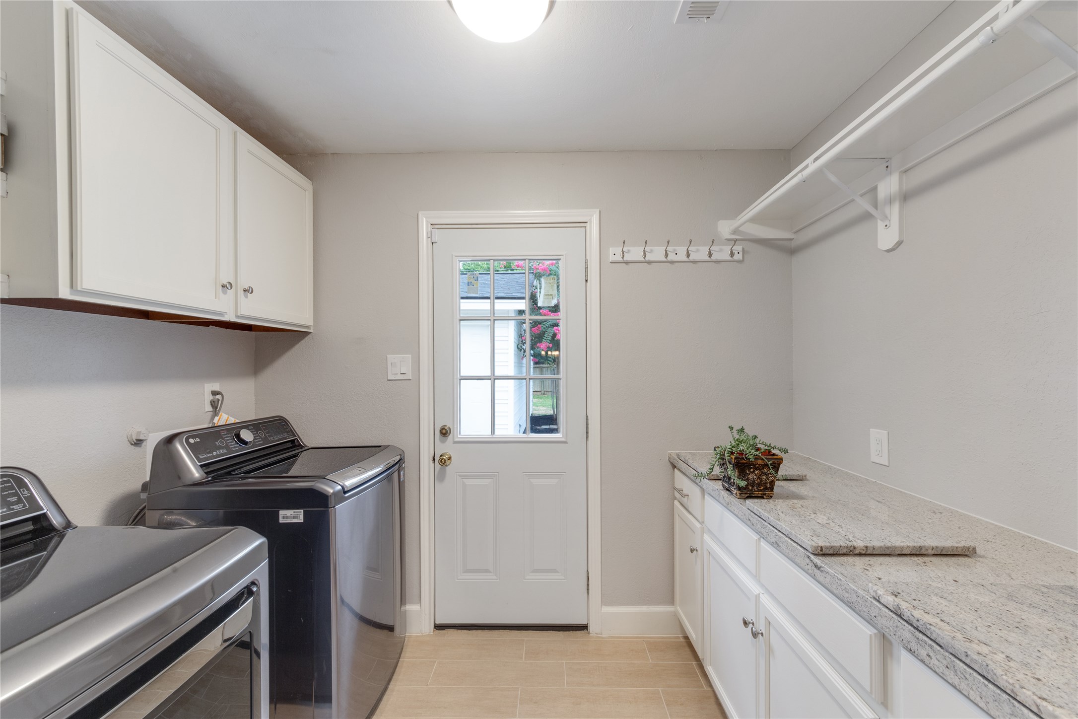 Spacious laundry room next to the kitchen gives you more work space.