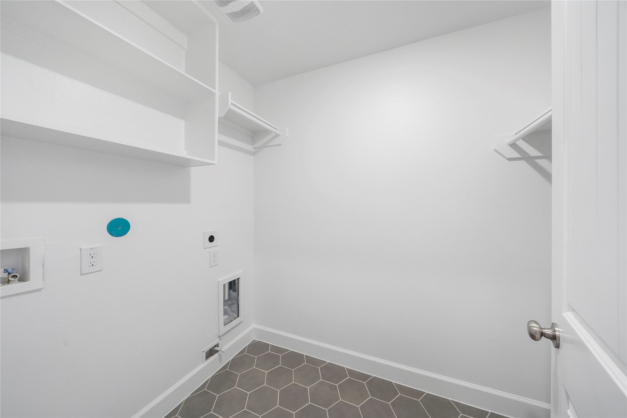The Utility Room is located on the second floor, and features built-in shelves for additional storage. (Sample photos of a completed Bordeaux floor plan. The image may feature alternative selections and/or upgrades.)