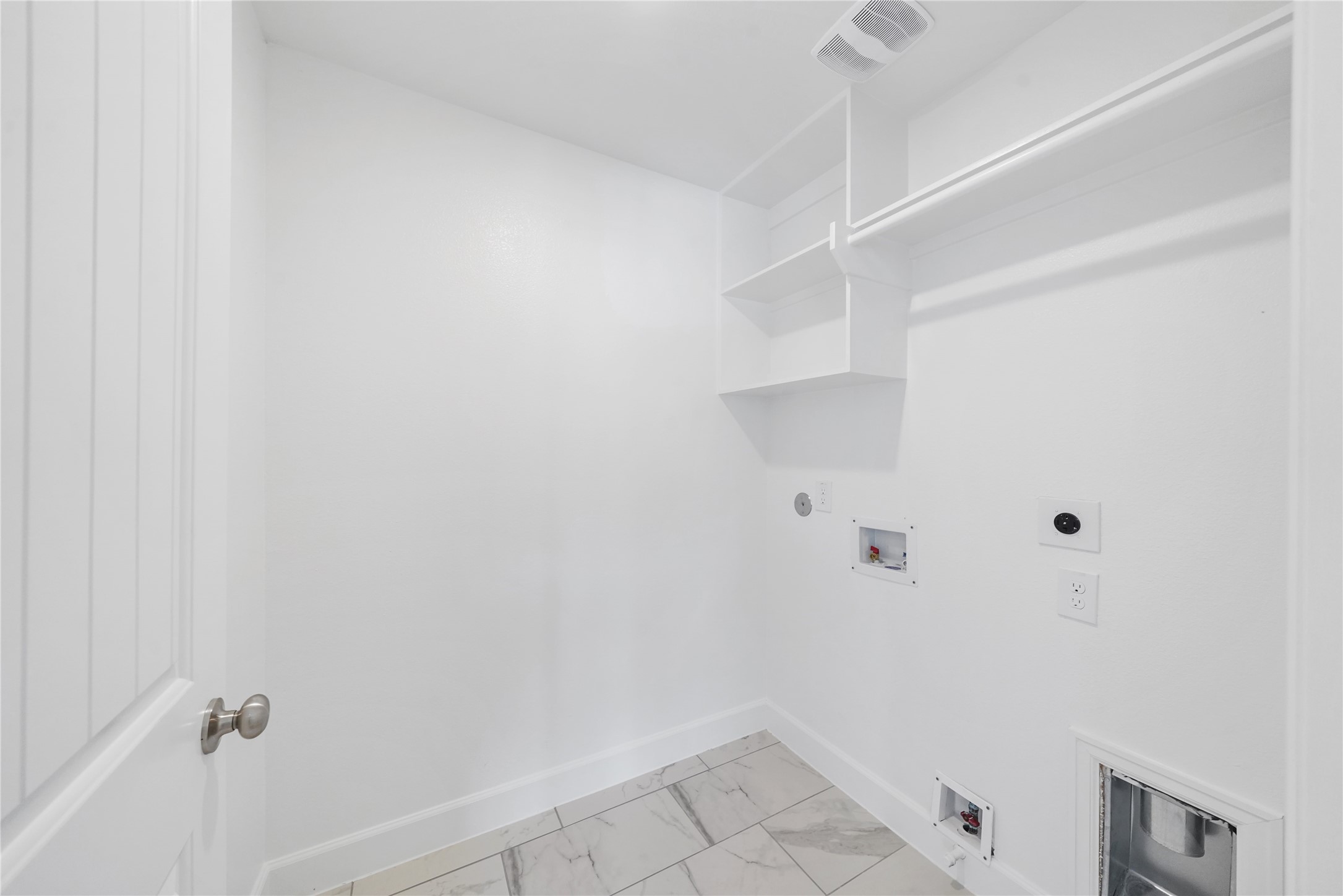 The Utility Room is located on the second floor, and features built-in shelves for additional storage. (Sample photos of a completed Athens floor plan. The image may feature alternative selections and/or upgrades.)
