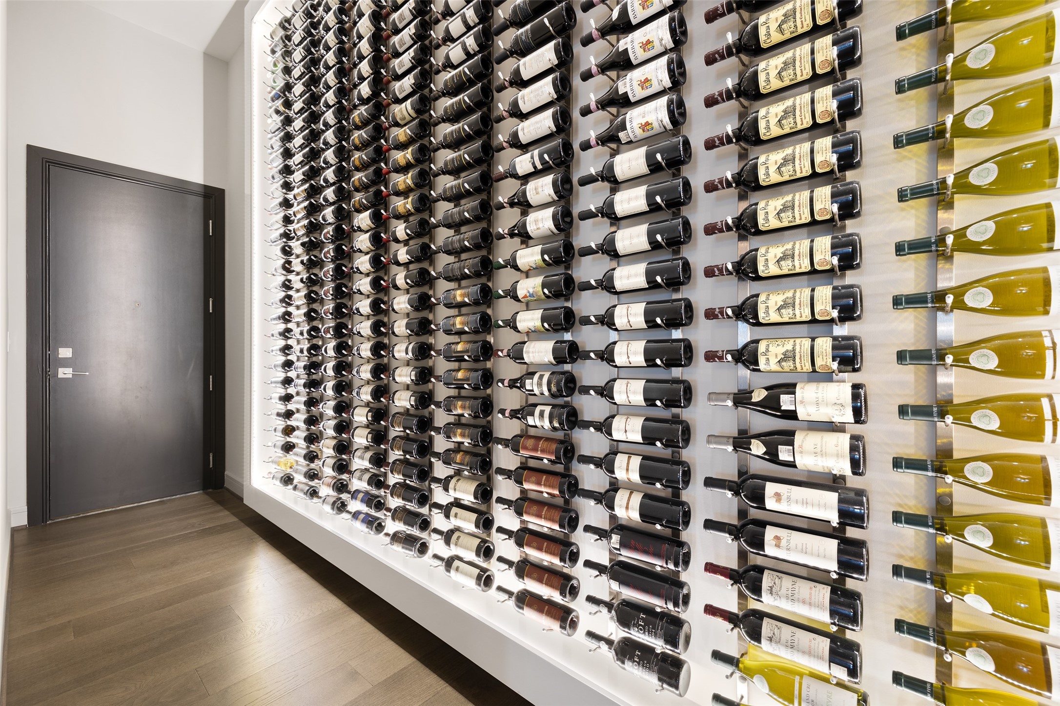 300 Bottle Wine Wall!  Beautifully displayed with feature lighting.