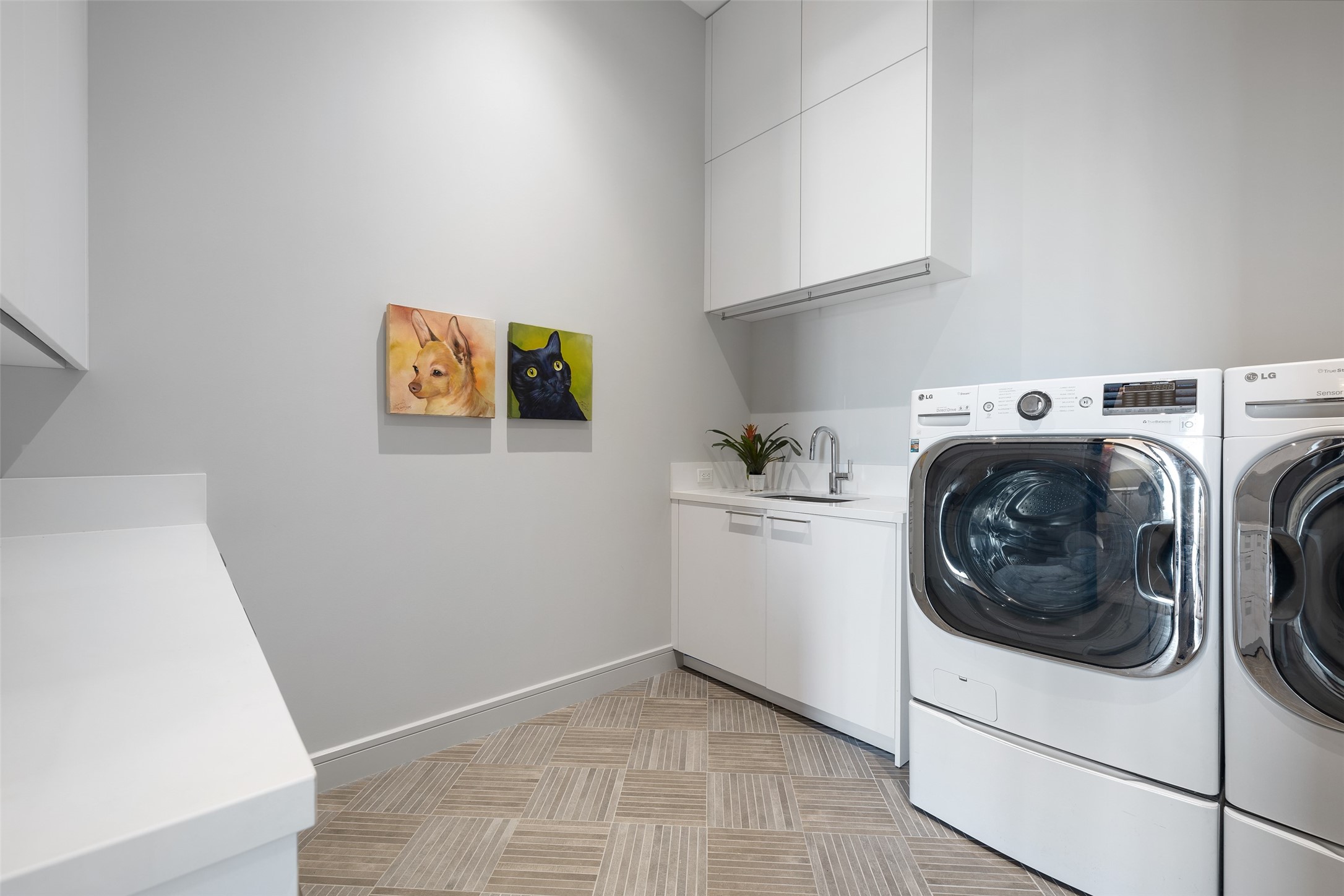 This laundry is larger than most bedrooms.  Tons of storage, counter space, and sink.