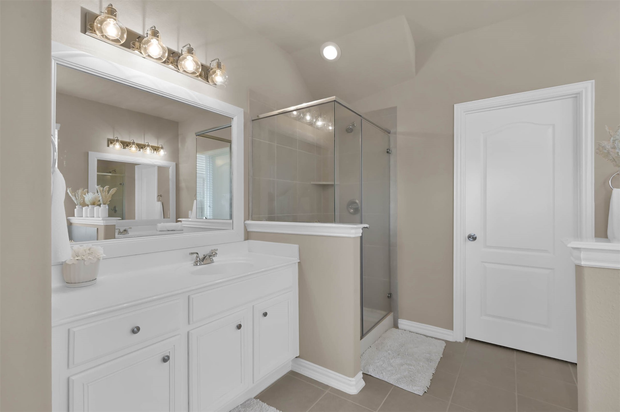 With a beautiful ensuite that offers separate vanities for those hectic morning routines.