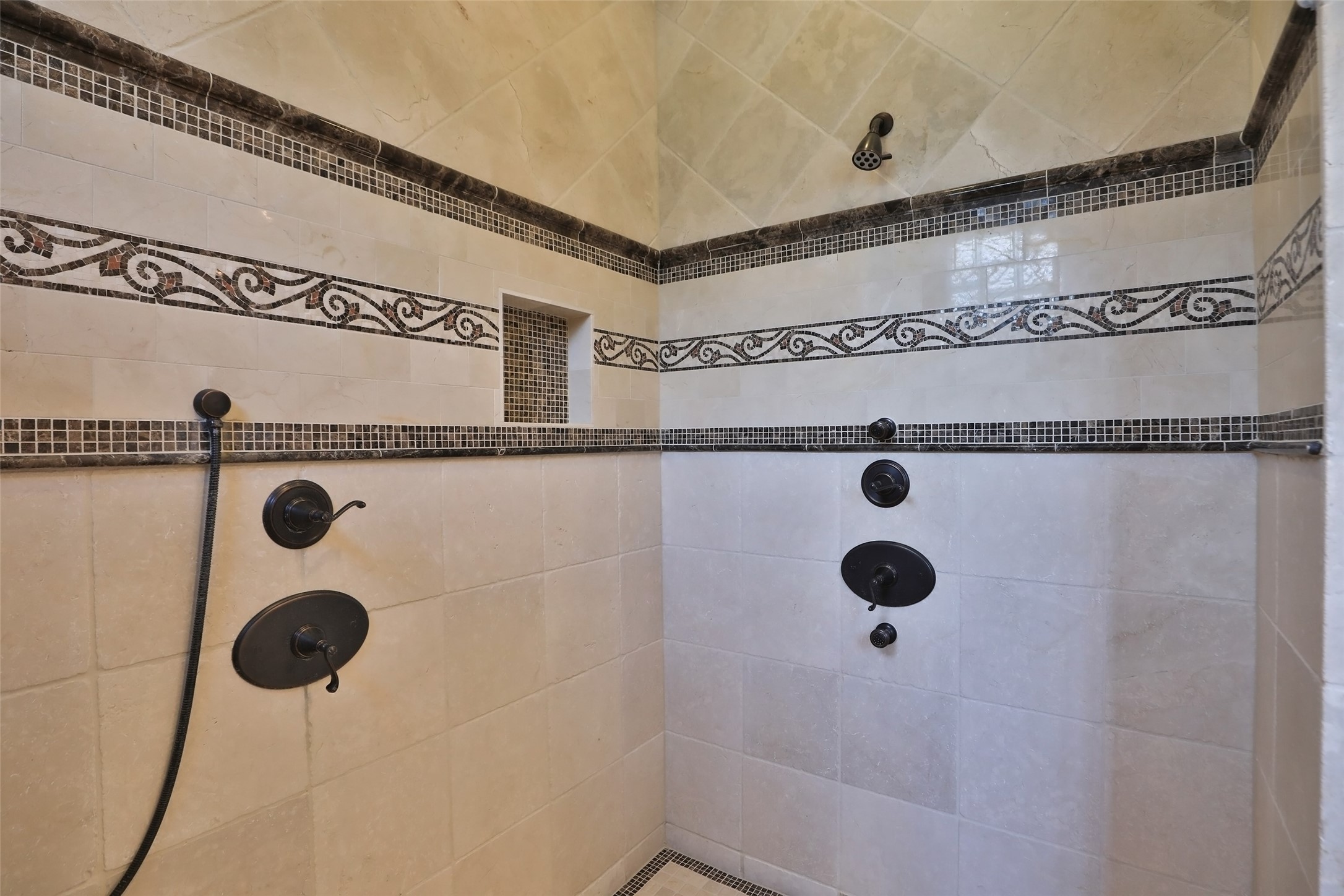 You will love this spacious walk in shower to relax in after long hard days. Beautifully designed with decorative tile and tile bottom.