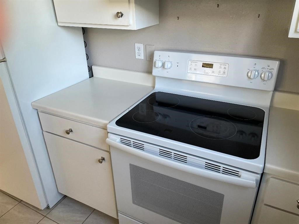 Electric stove in kitchen.  Refrigerator included.