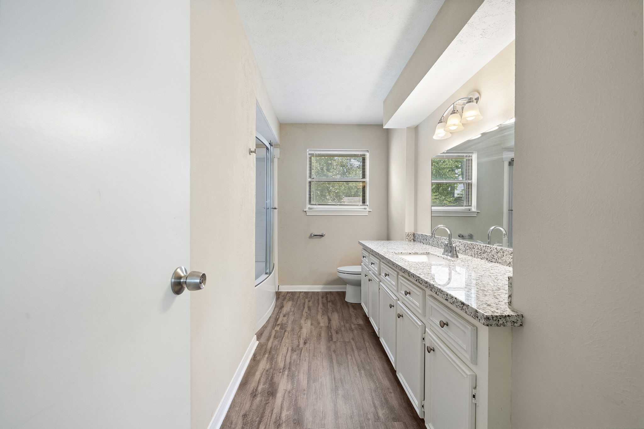 Shared updated bathroom is spacious and inviting