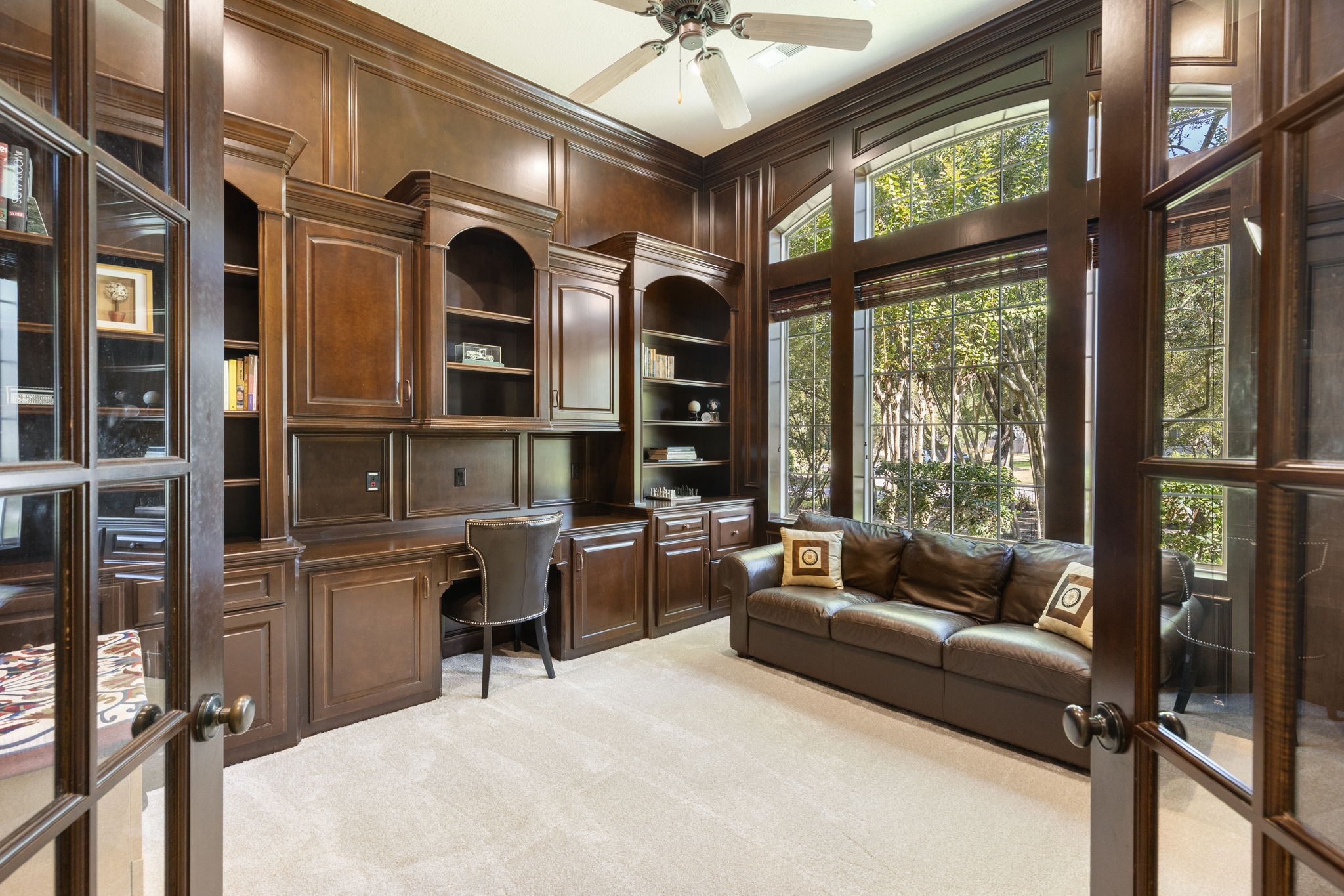 The well-appointed study is situated just off the entry and creates a refined workspace with custom built in desk and bookcases, high ceilings and new carpet.
