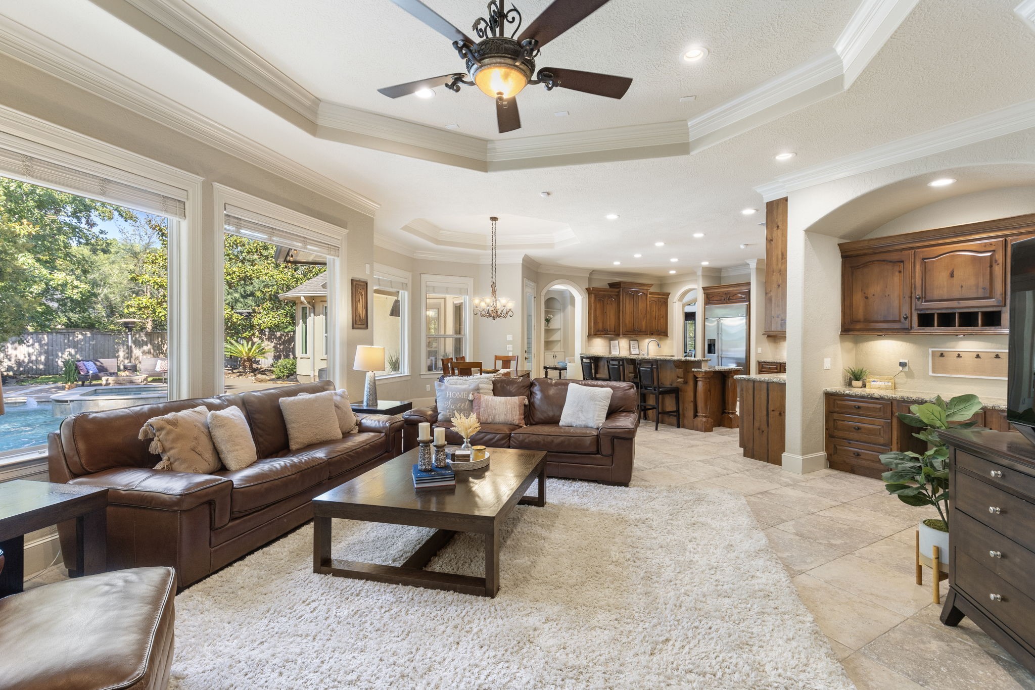 This view provides a look at the open concept floorplan to the breakfast nook and gourmet kitchen - perfect for entertaining and spending time with family and friends.  New energy efficient LED lighting installed through the home is August of 2023.