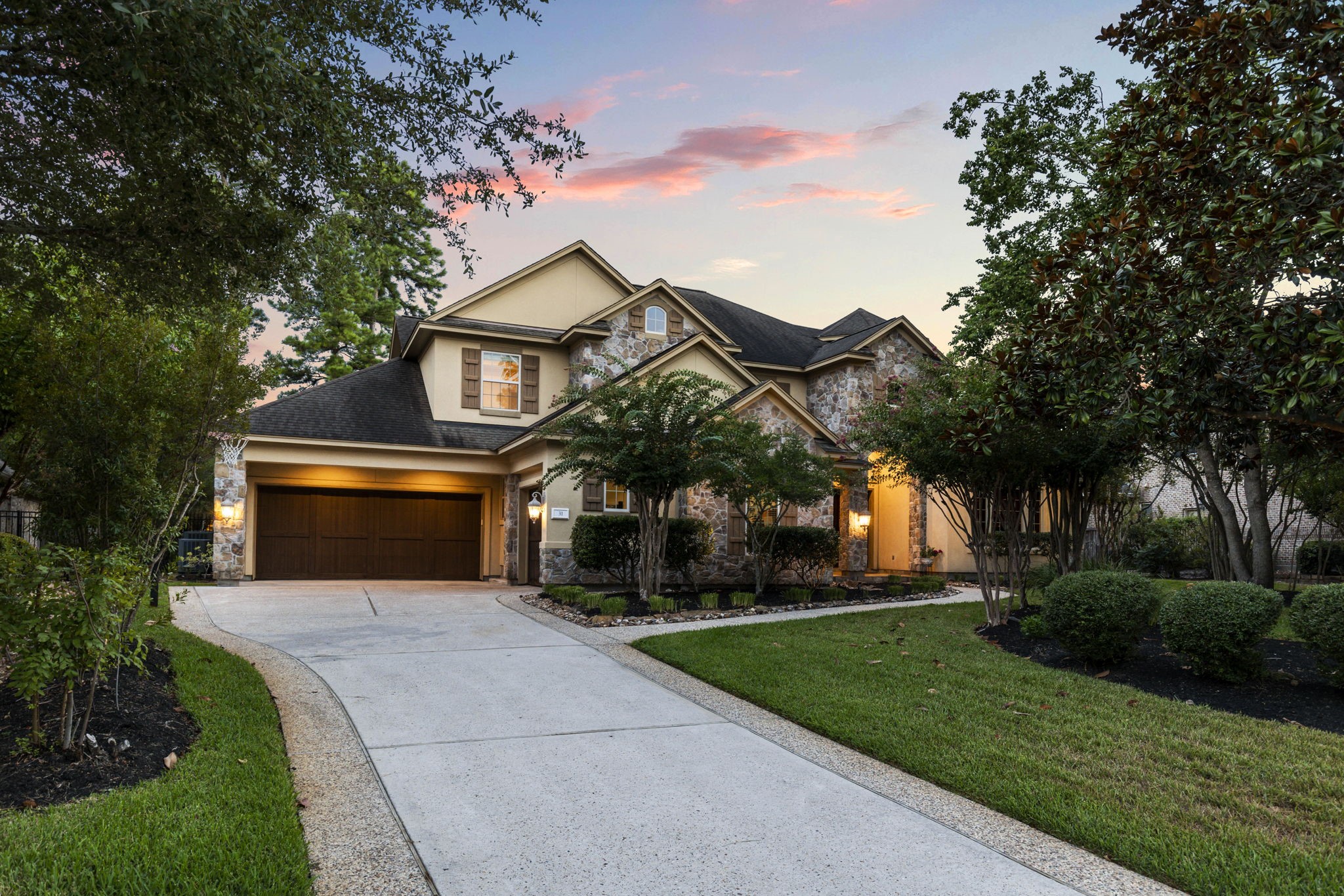 This 5 bedroom, 4.5 bath home has wonderful curb appeal with a blend of stucco and stone finishes, exceptional craftmanship and meticulous landscaping.