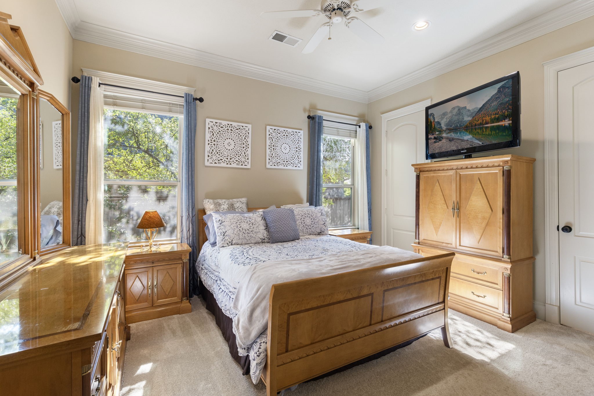 This Secondary bedroom is located downstairs off of the family room allowing for privacy for guests.   With new carpet, crown moulding, neutral paint, a sizable walk-in closet and access to full en-suite bathroom.  This space is also an option for multi-generational living.