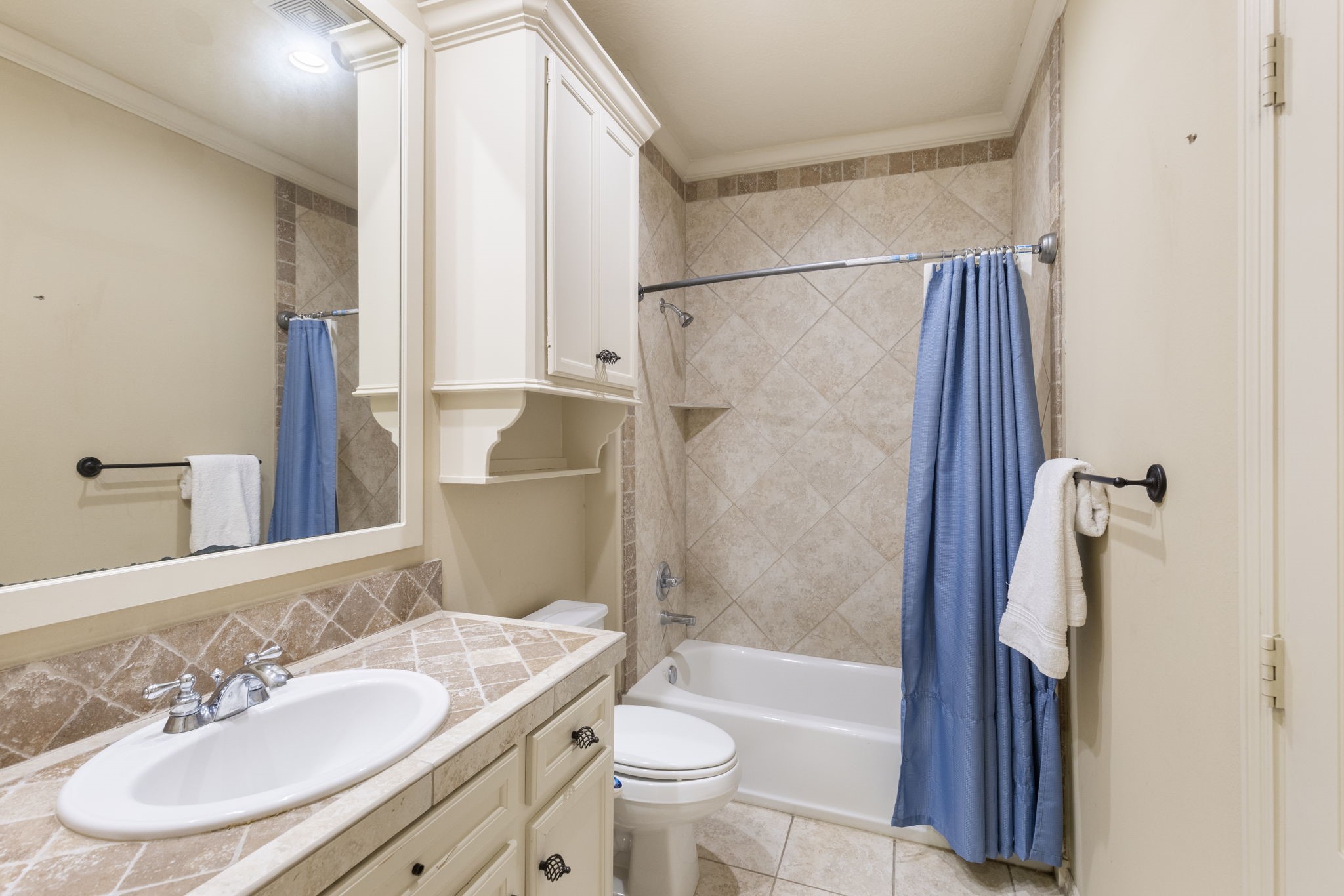 Ensuite bath has a good-sized vanity with rubbed bronze hardware, tub/shower combination with tile surround and LUXE bidet feature.  The closet is efficiently located in the private bathroom.