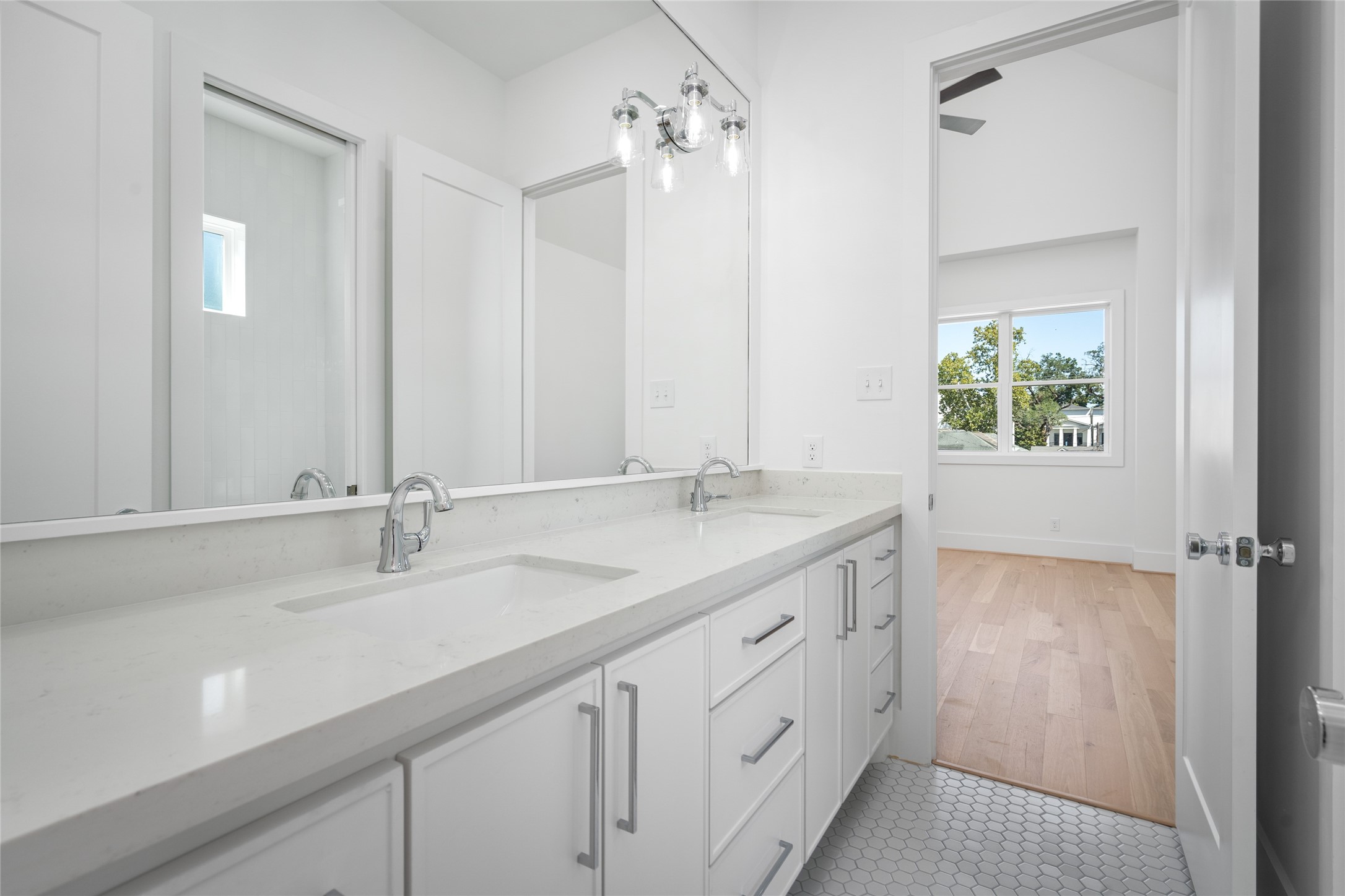 Quality is found throughout the home, including the secondary bathrooms. Custom cabinetry, quartz counters and beautiful tile flooring.