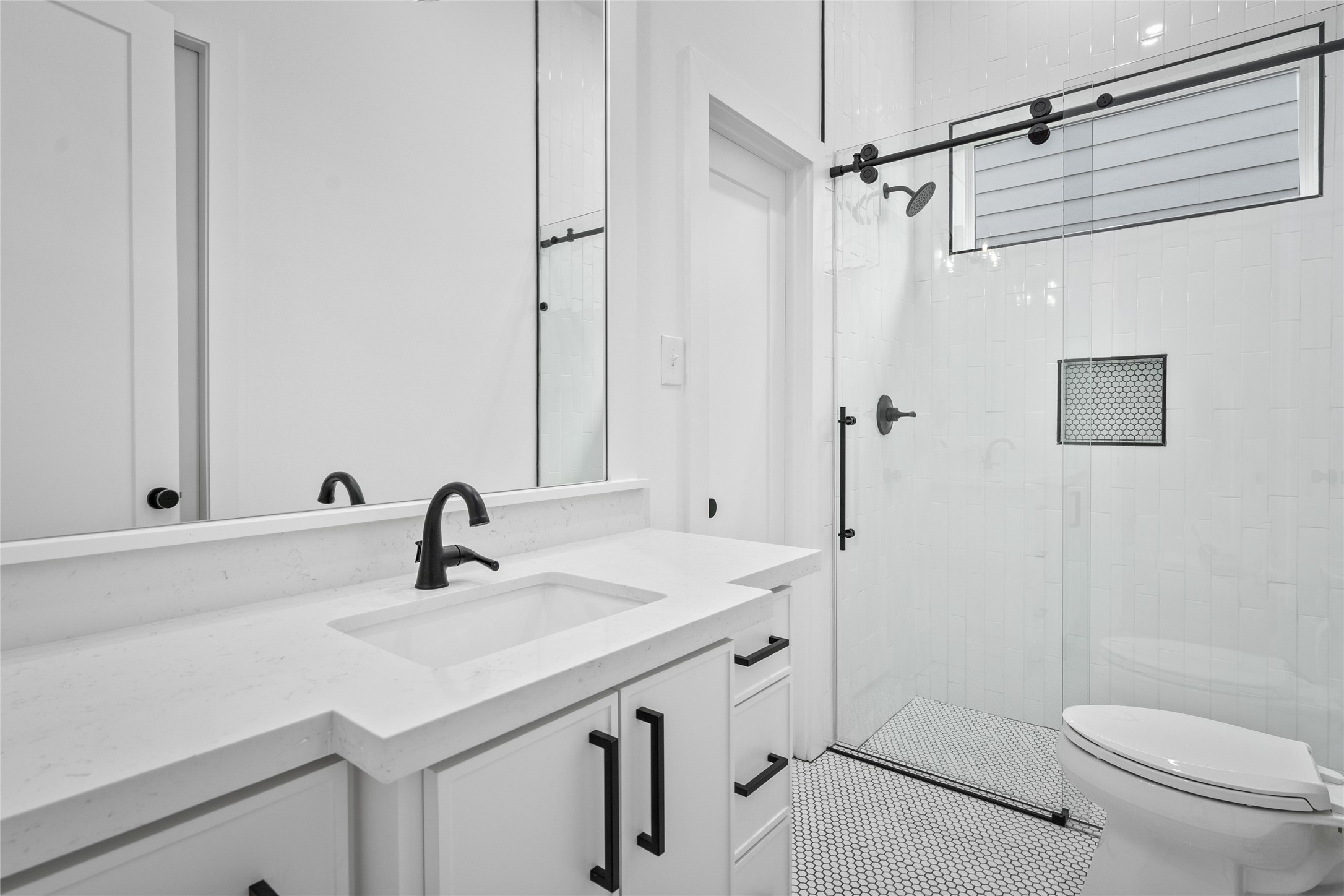 The beautifully designed en-suite full bathroom can be accessed via the 1st floor bedroom and the hallway.