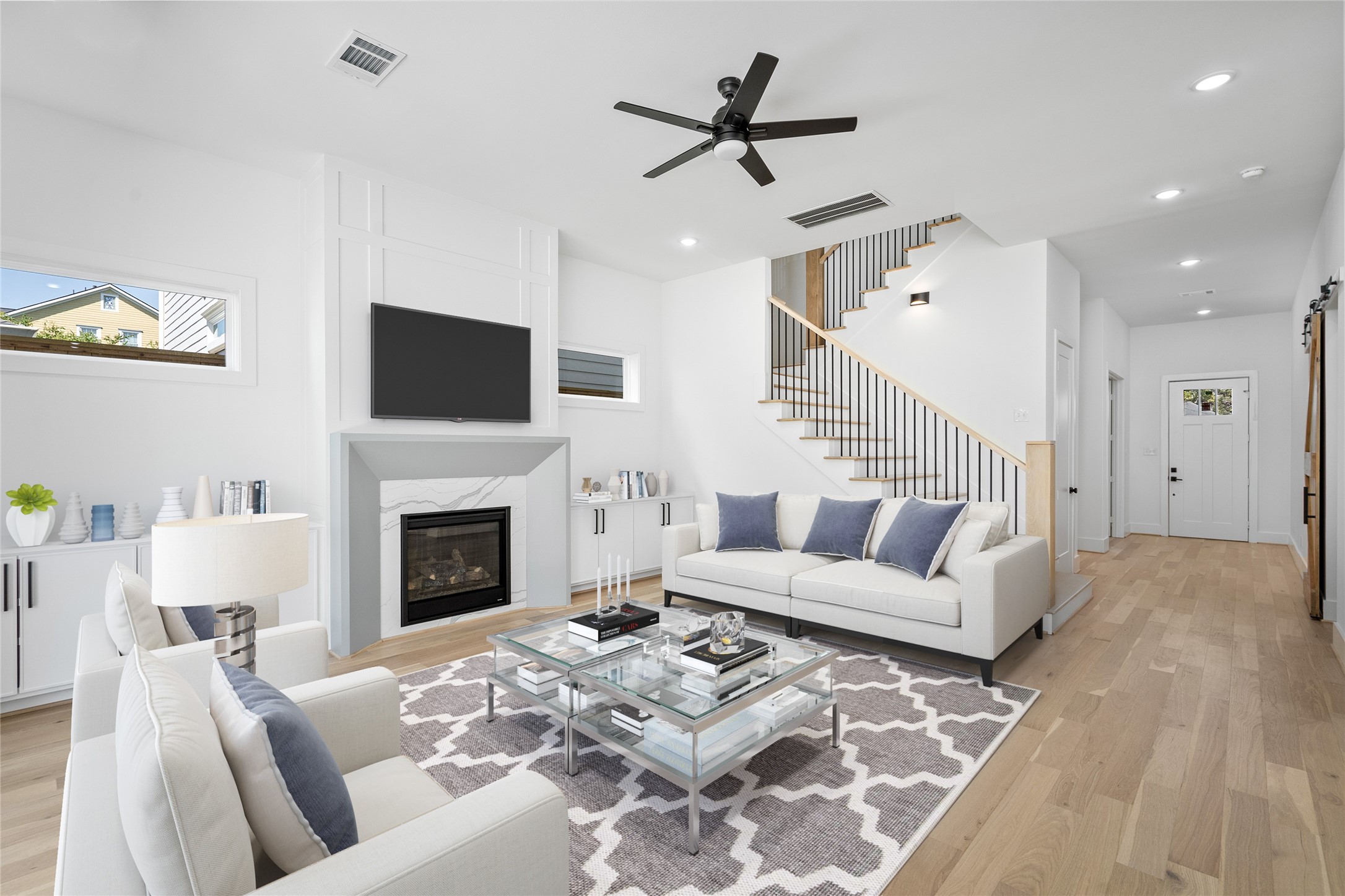 The home features beautiful engineered wood flooring throughout and sits beneath tall ceilings. *Virtual staging has been added*