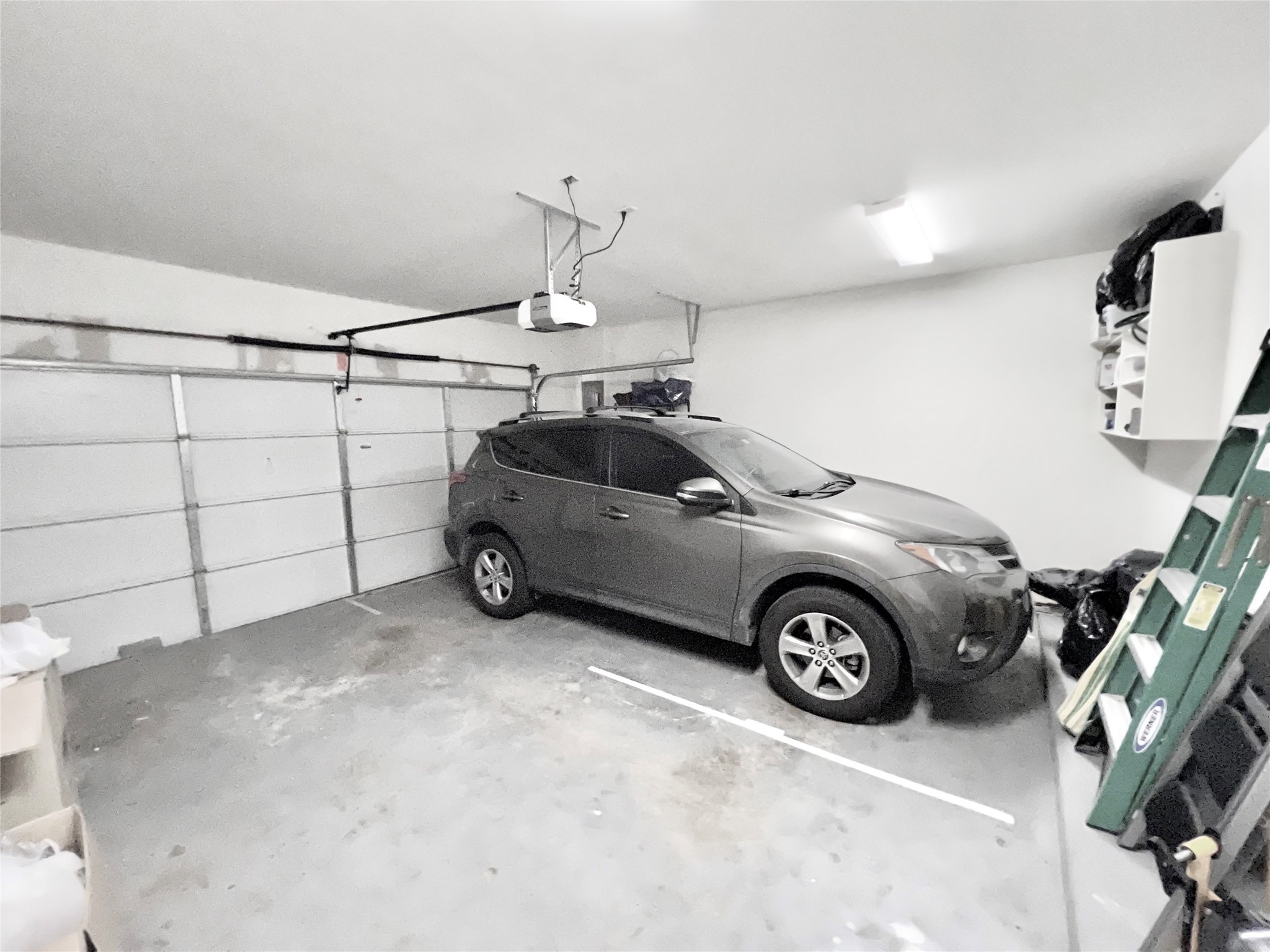 2 car garage with room for work benches and storage.