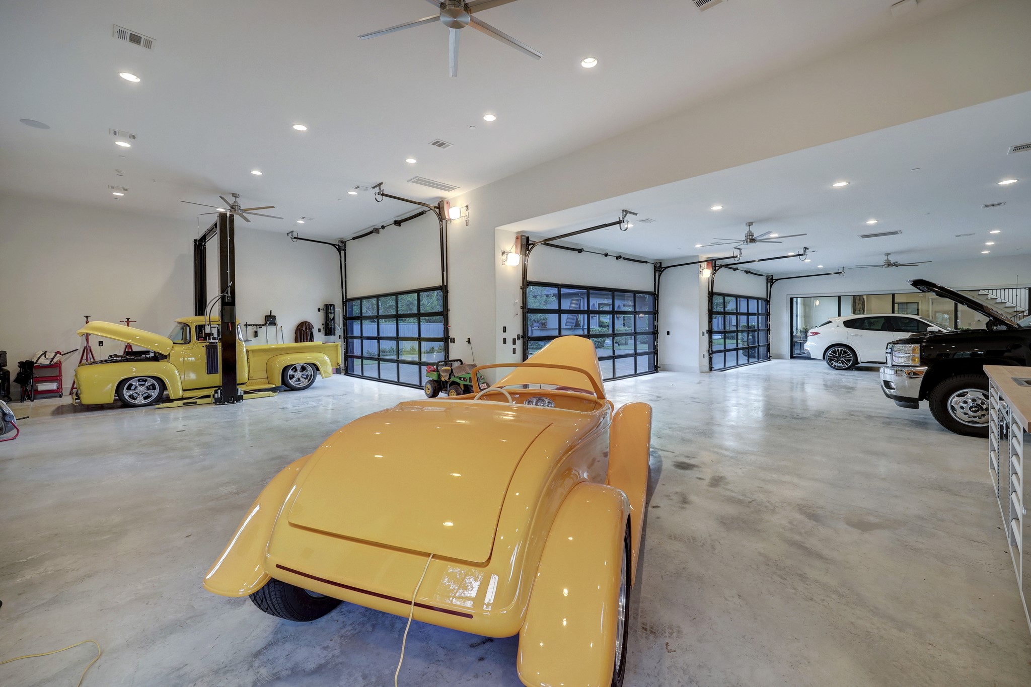 Another angle of the substantial 10 car garage. Lots of room to fit more cars for even the most avid of a car collector.