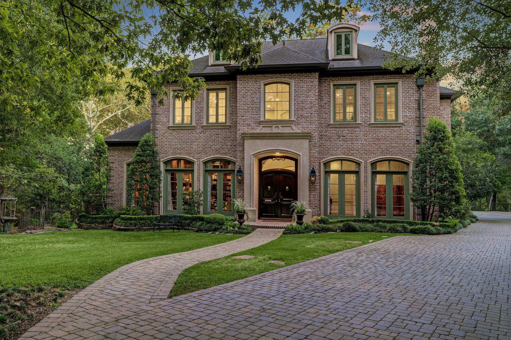 Exquisite custom estate in Sandalwood situated on a gorgeous, wooded 107,439 sq ft lot.