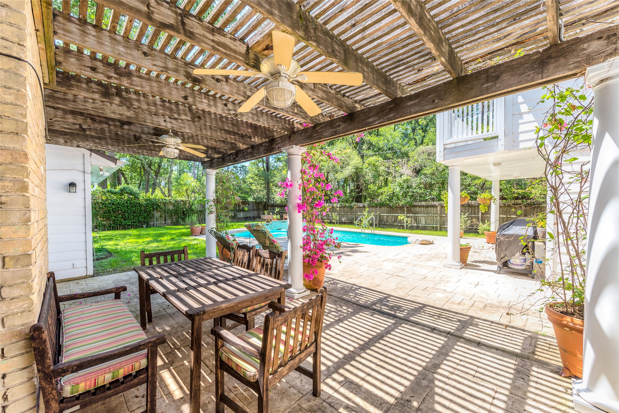 Beautifully maintained patio/deck next to pool - perfect for Houston summer.