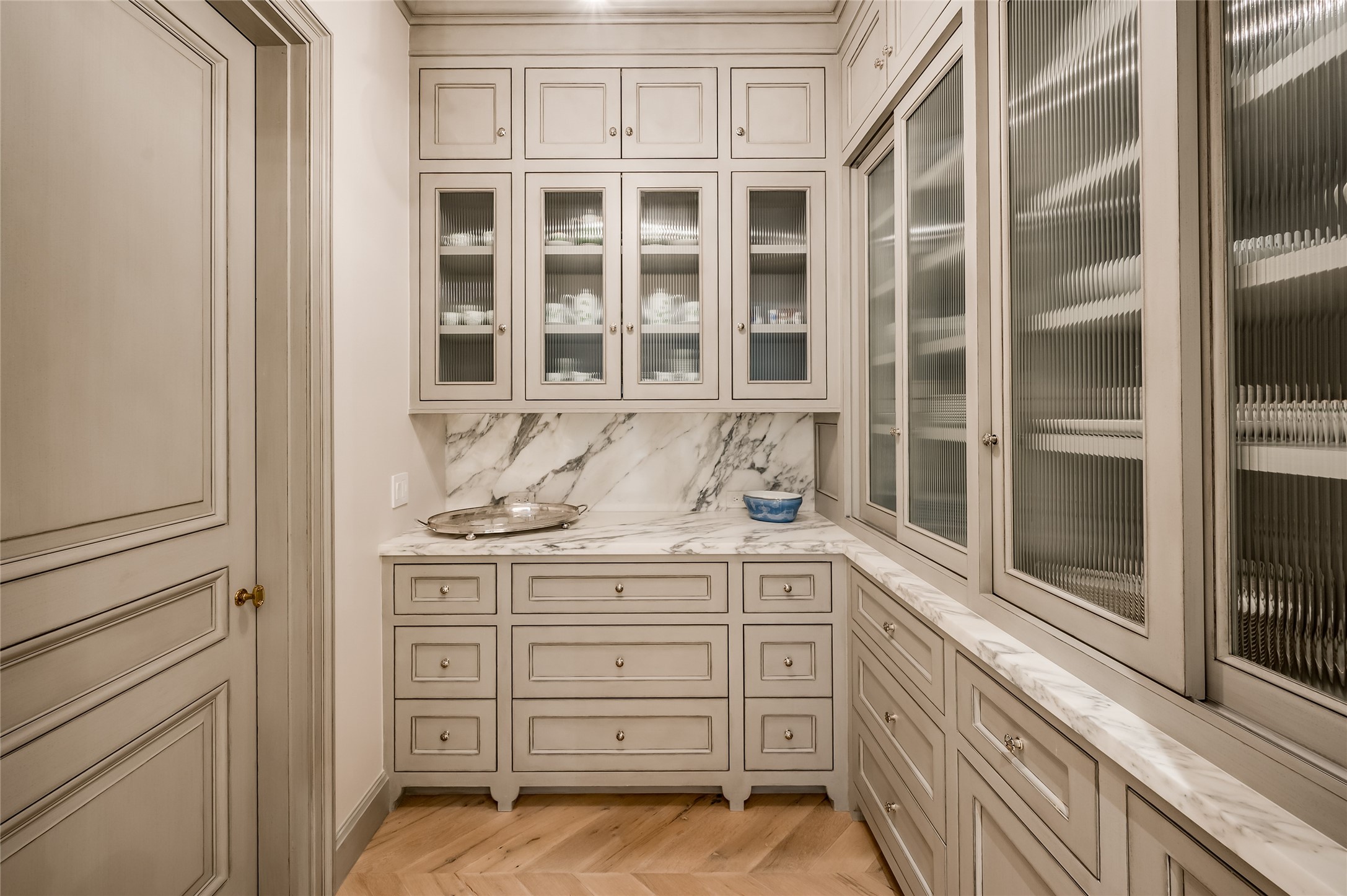 The butler's pantry with an abundance of inset cabinetry and storage.