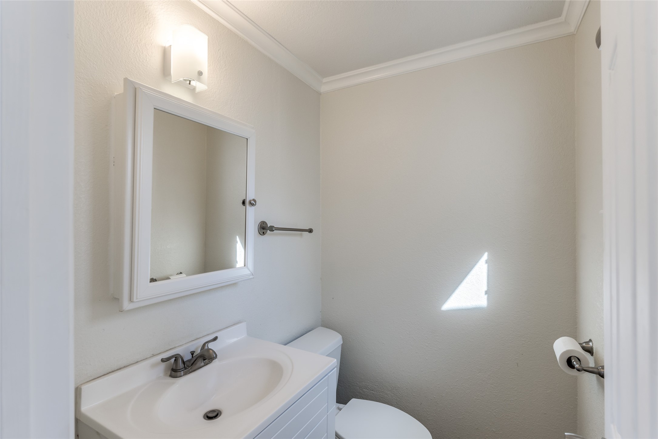 A half bath is conveniently located close to the bonus room, pool area, and in-home laundry room.
