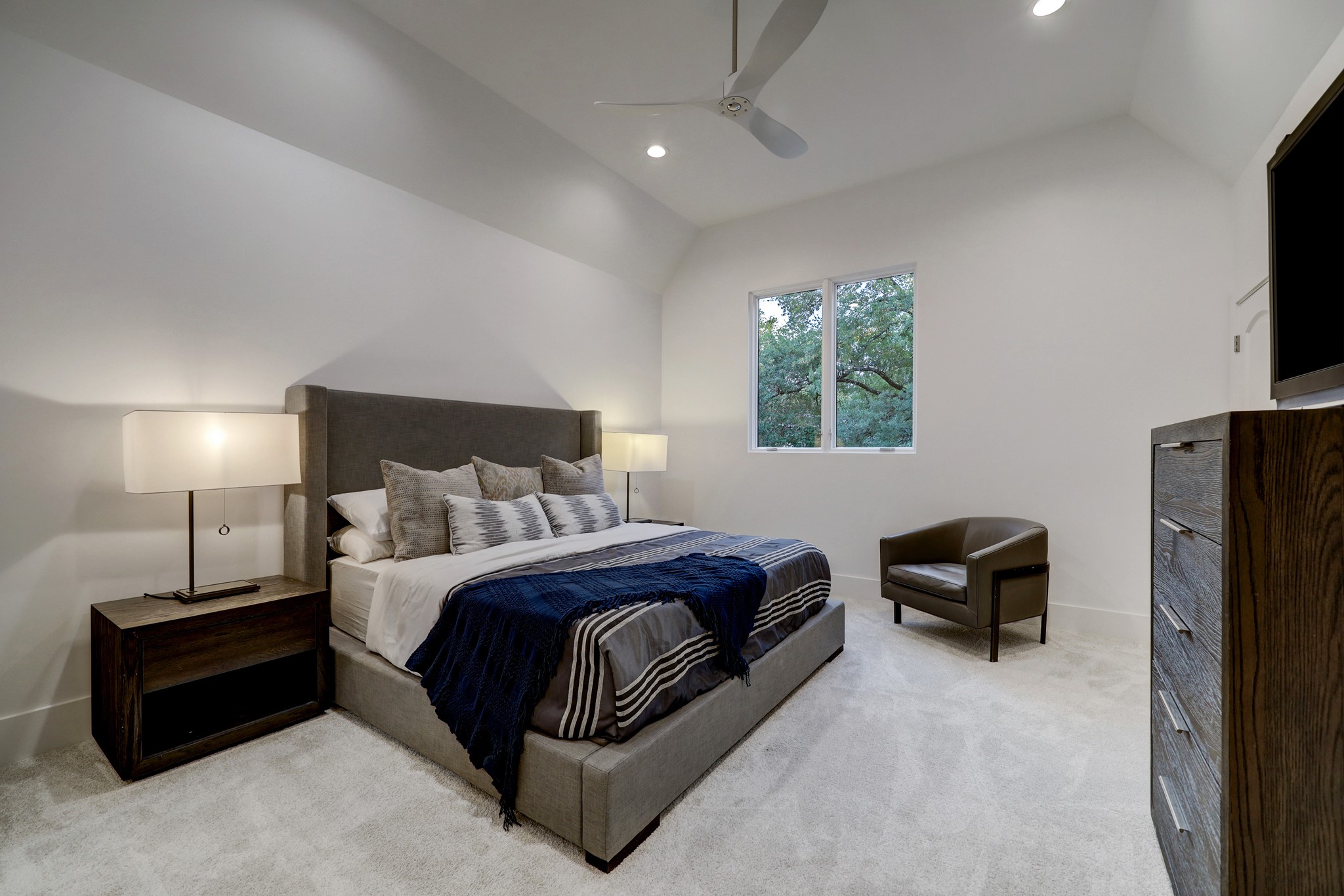 secondary bedroom with ensuite bath, generous closet and Monte Carlo ceiling fan.