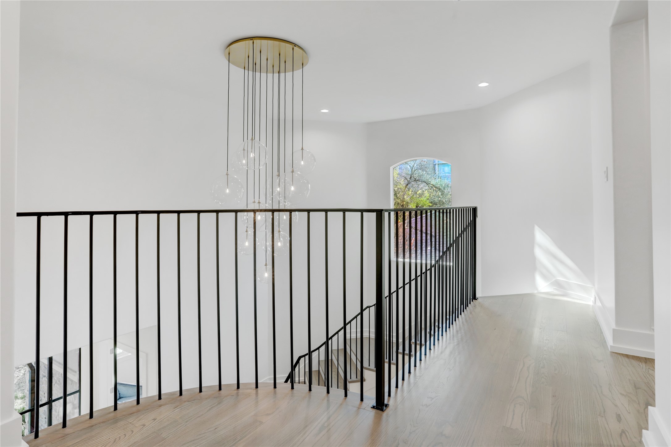 Take in this awe inspiring Foyer Chandelier from the second floor landing.