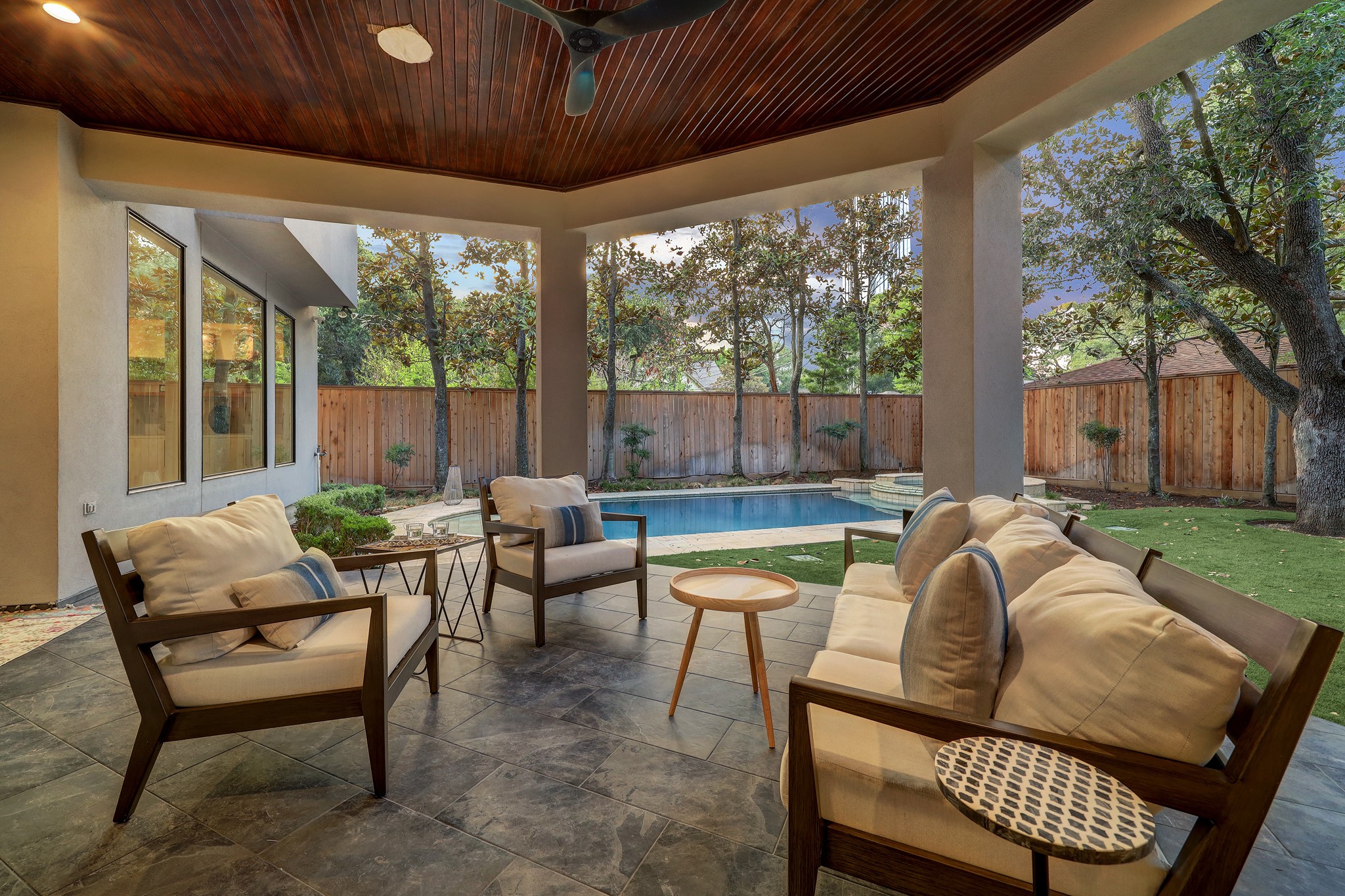 Generous covered patio for grilling out or just relaxing pool side.