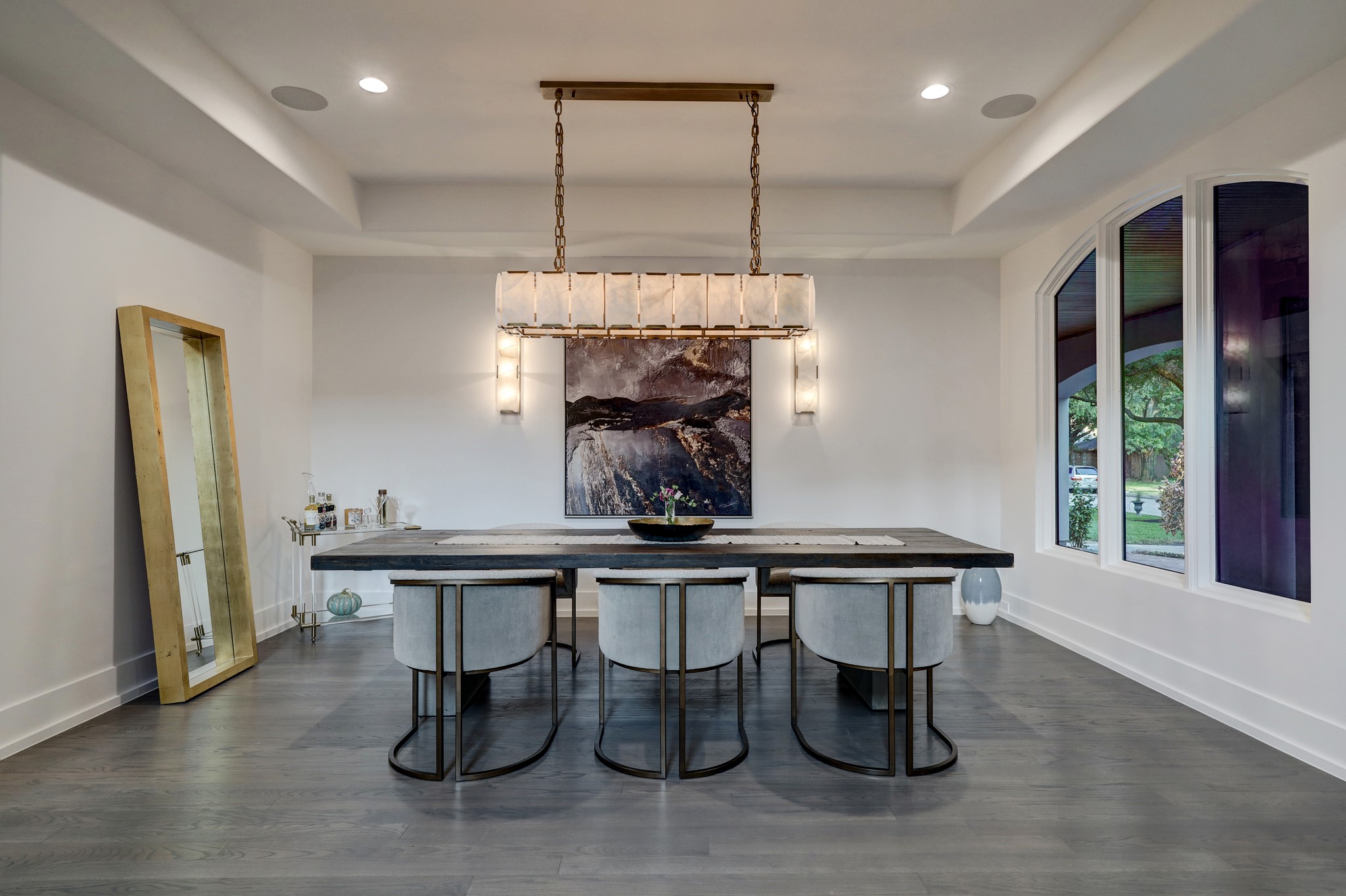 The formal dining room features Restoration Hardware chandelier and wall scones. Restoration Hardware Chandeliers and Lighting Fixtures are throughout the home.