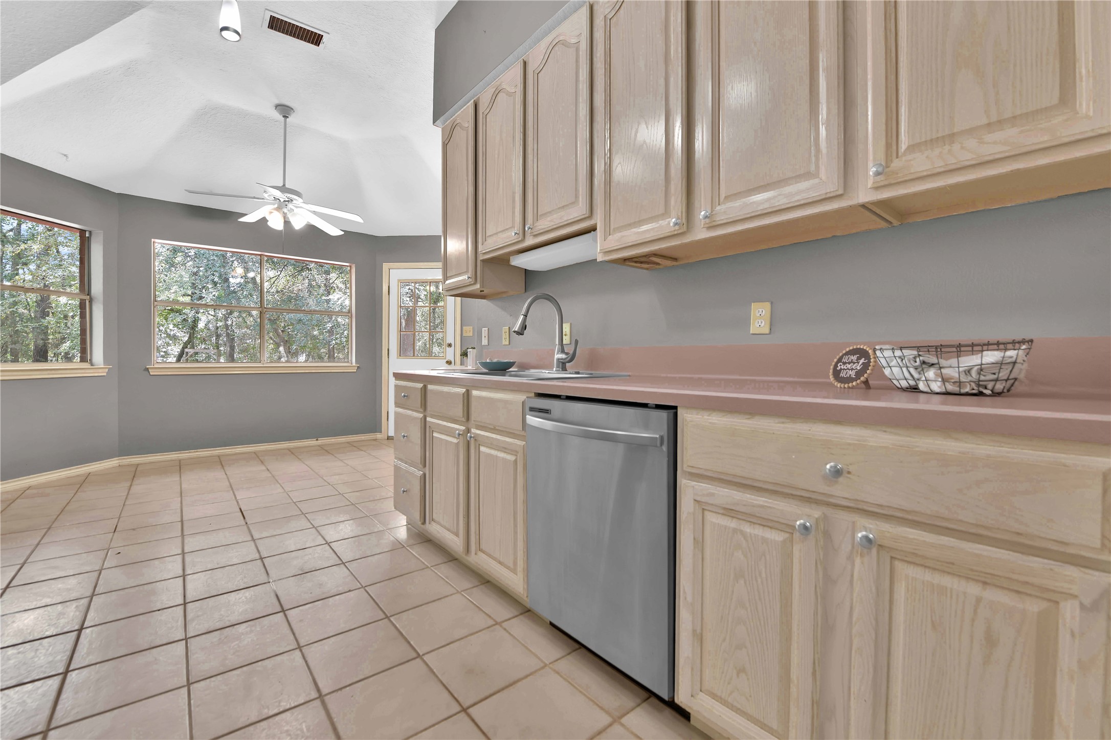 16603 Surrey Ln-  Kitchen is a large galley style kitchen with a breakfast room for your outdoor viewing pleasure.