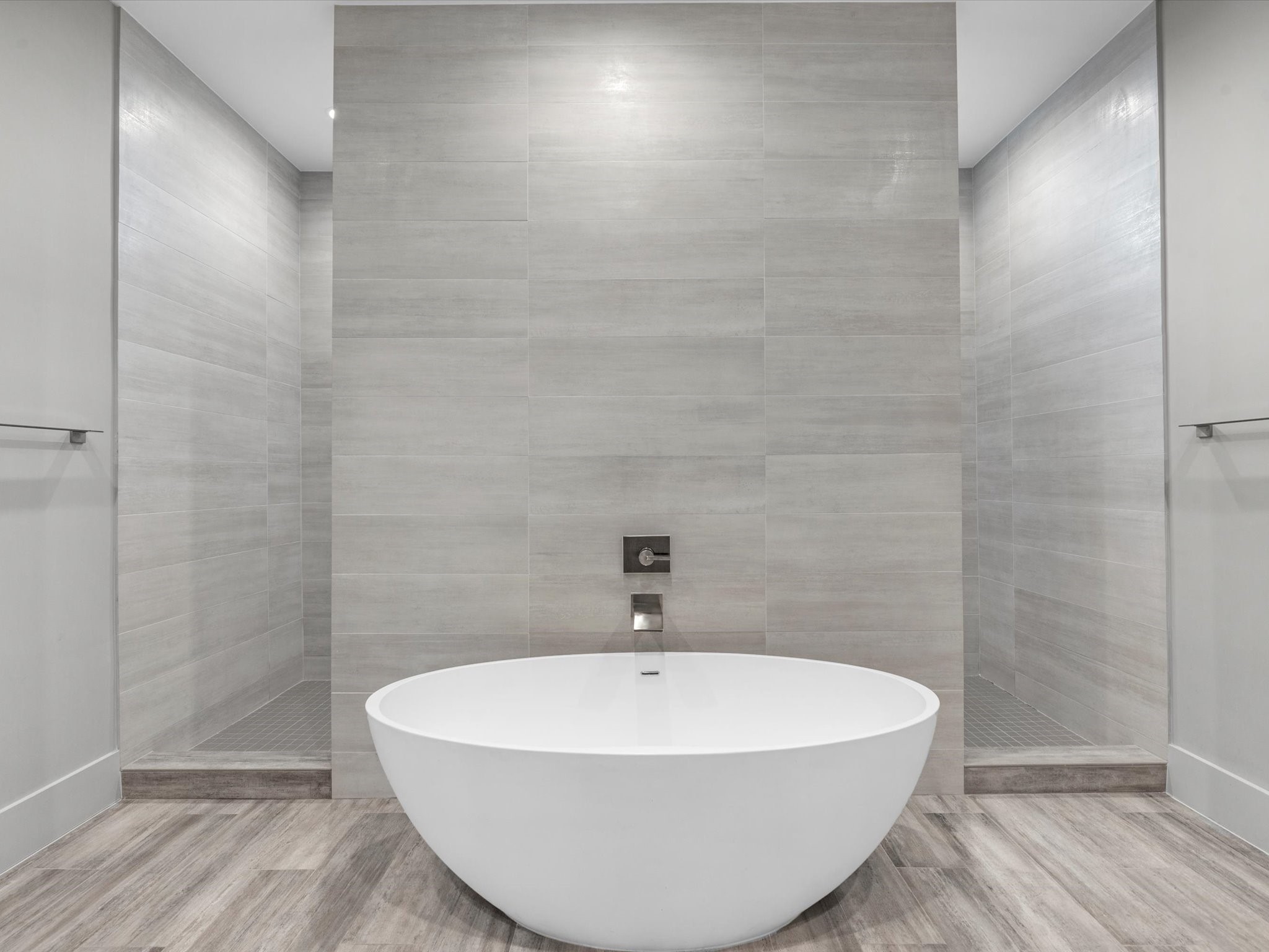 The primary bathroom features a freestanding tub and huge walk-in shower!