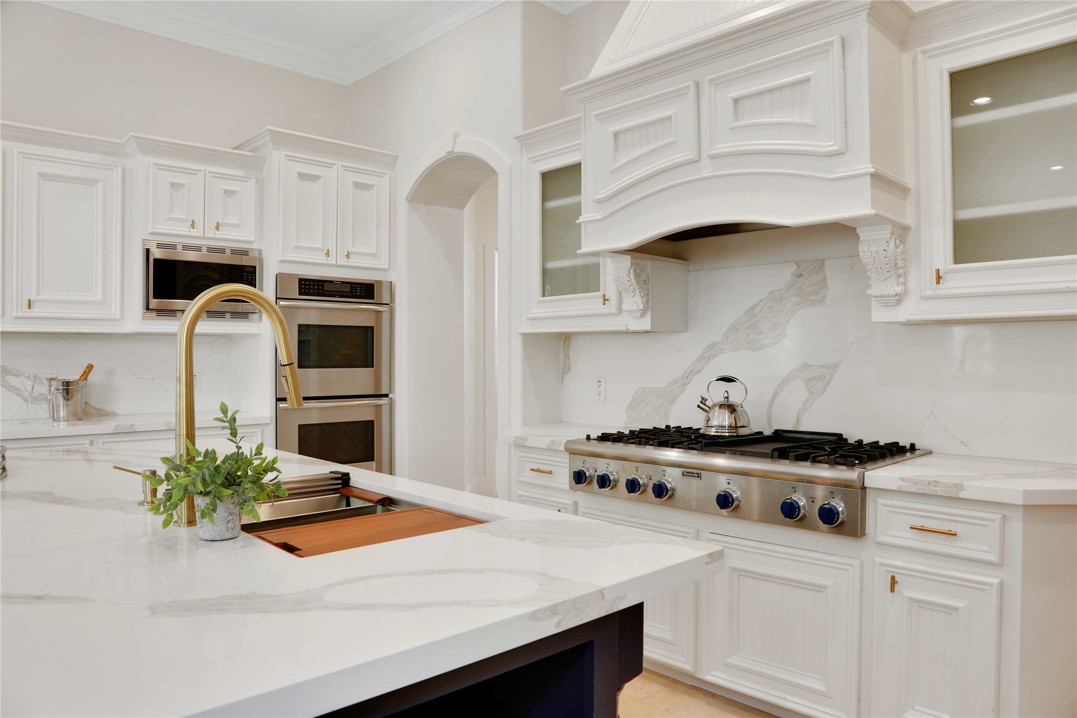 The updated kitchen is a chef's dream featureing a stunning Quartz Island and custom cabinetry, exuding both style and functionality.
