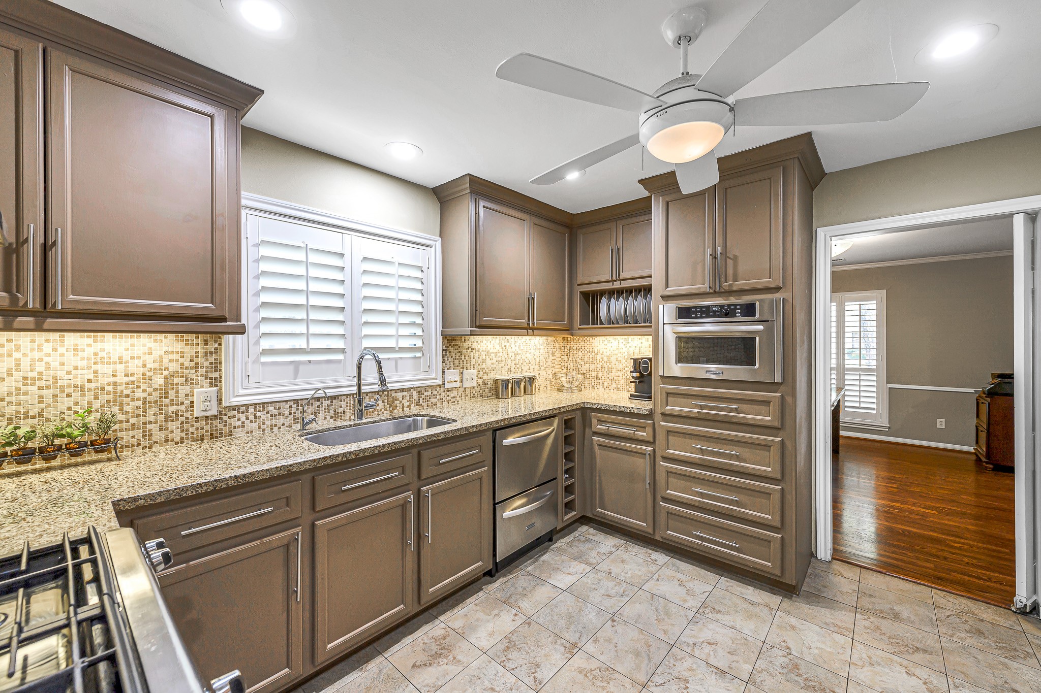 This updated kitchen is a harmonious blend of classic elegance and modern convenience.
