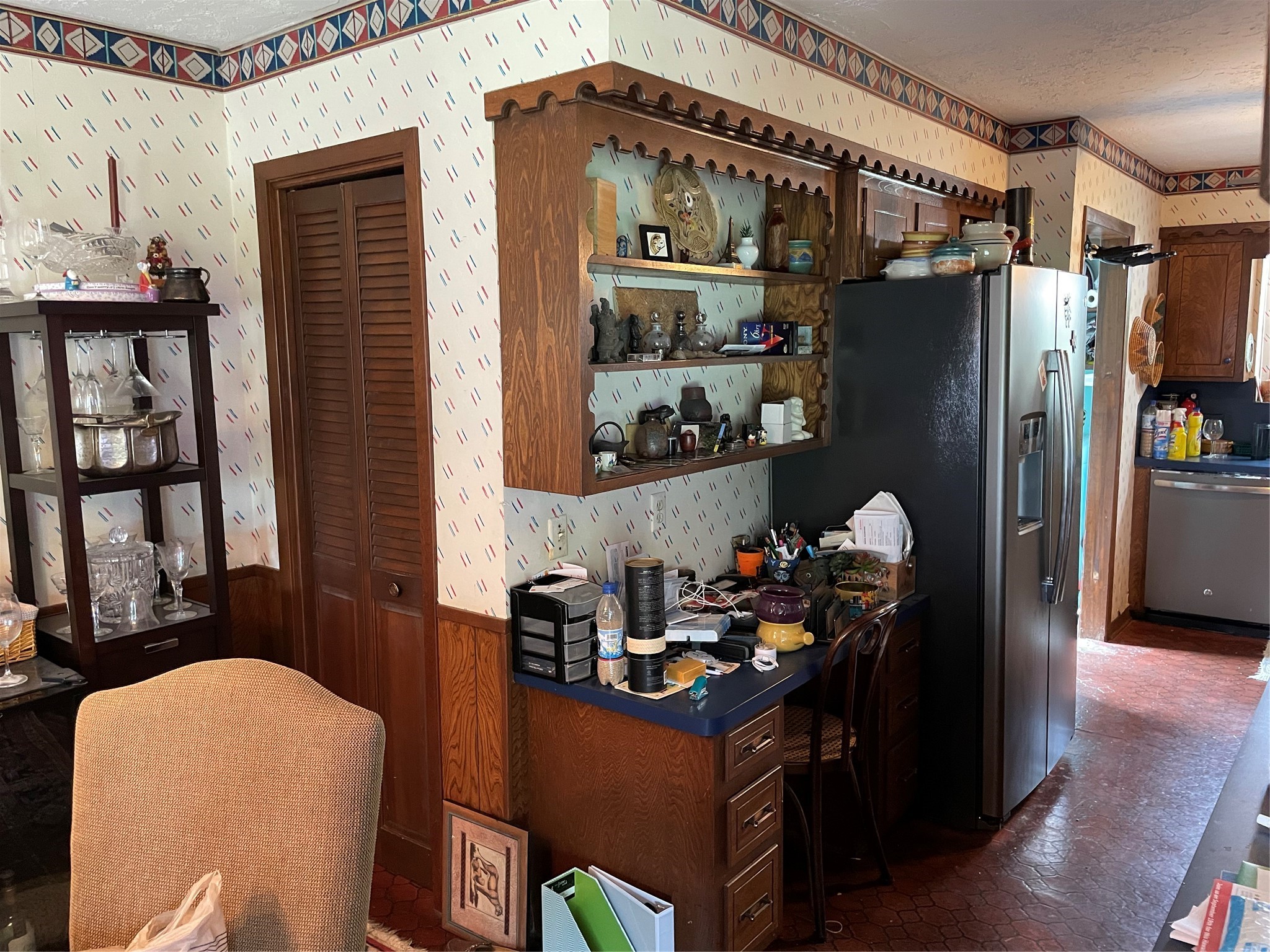 desk area by kitchen