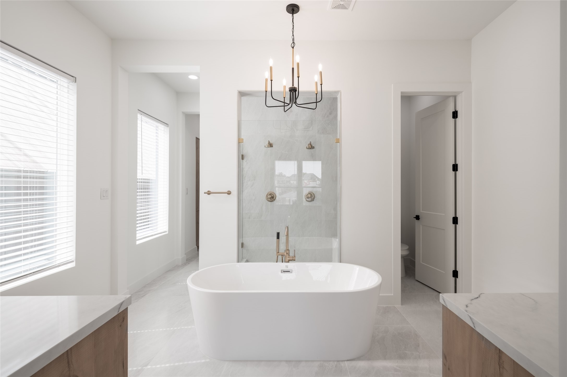 Stunning bath with soaker tub, oversized shower with 2 shower heads and separate, his and her vanities