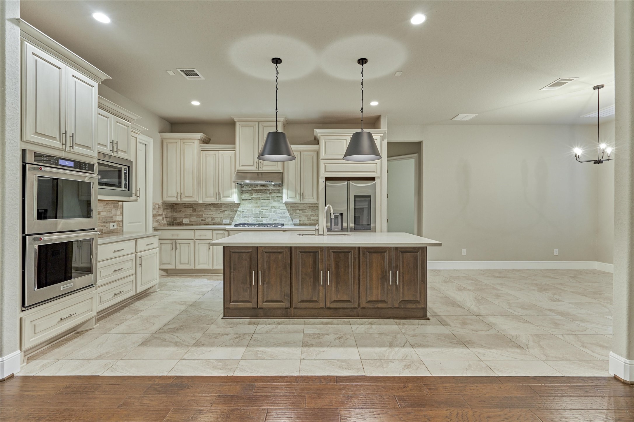 This gourmet kitchen features a beautiful quartz island with plenty of room to prep many delicious meals!
