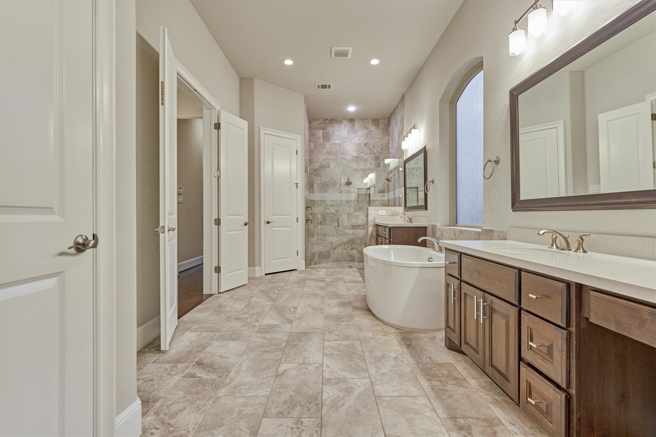 This spacious bathroom provides plenty of room for sharing.
