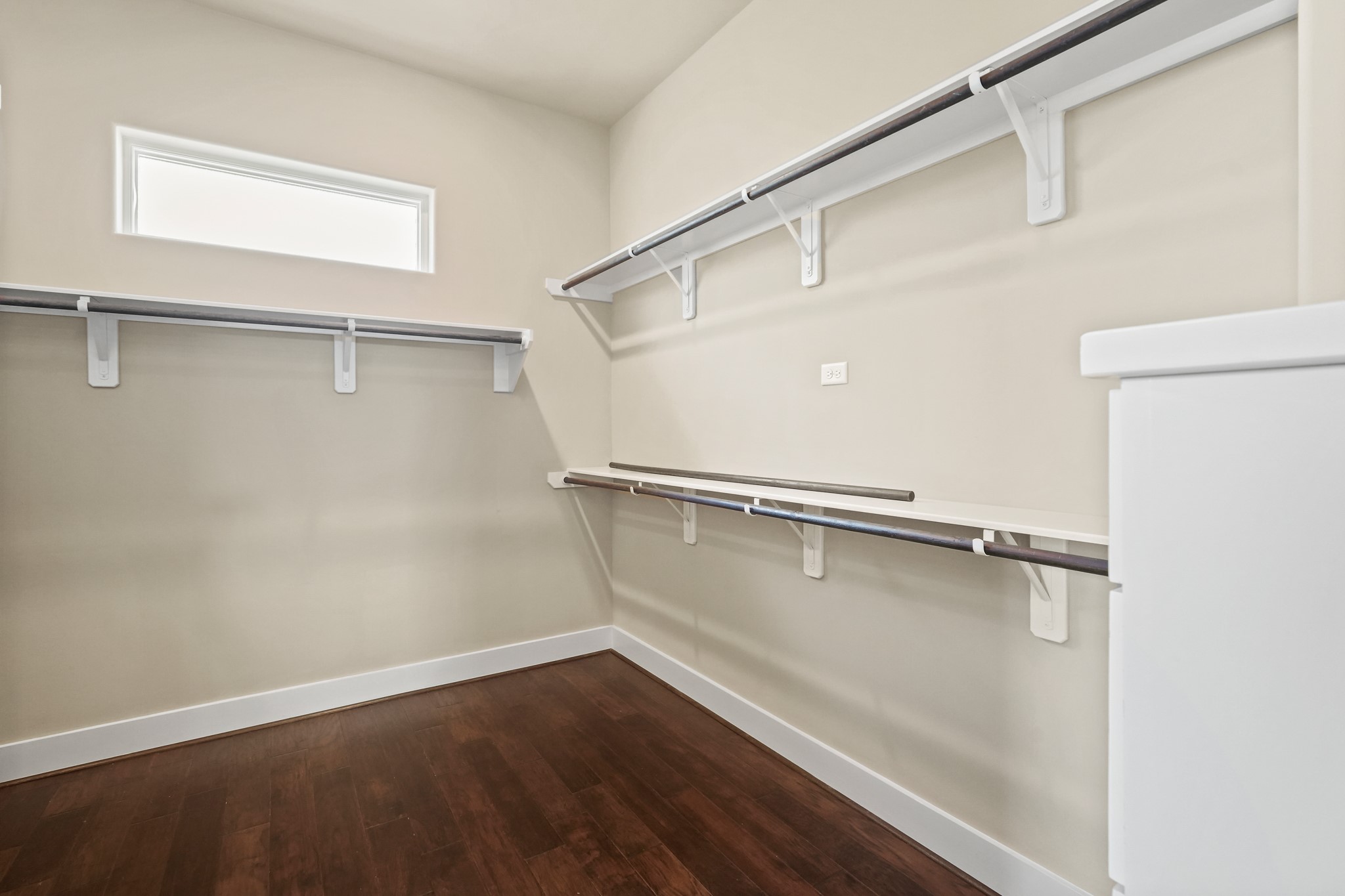 Enormous walk-in closet adjacent to ensuite master bathroom features an abundance of space for your personal effects.