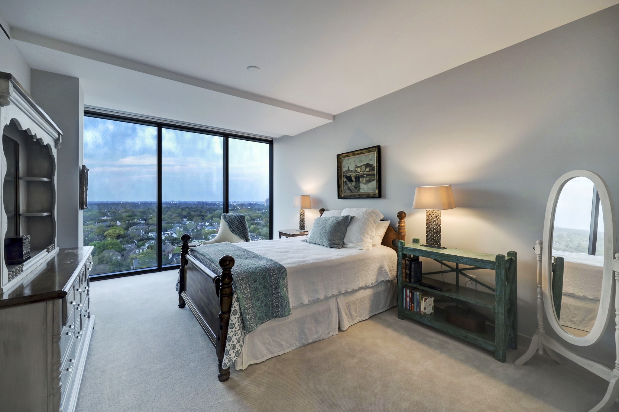 One of two secondary bedrooms that have north facing tree-top views and private baths.  This bedroom also features a large walk-in closet.