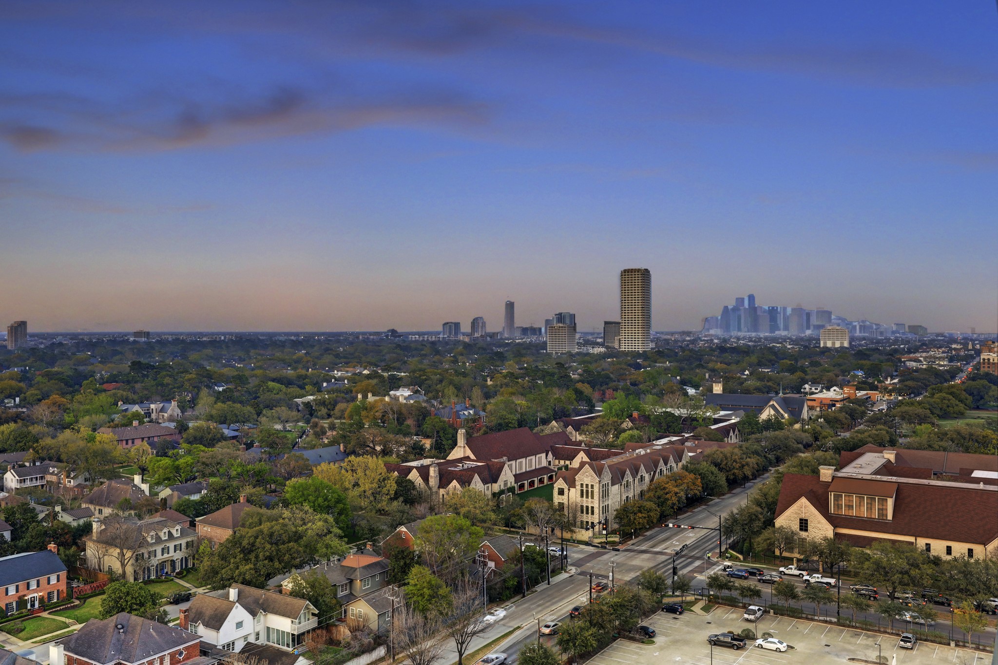 The views from the covered terraces of the residence are unparallelled.  This view is to the east, looking over St. John's School, the River Oaks neighborhood, toward the Houston Central Business District.