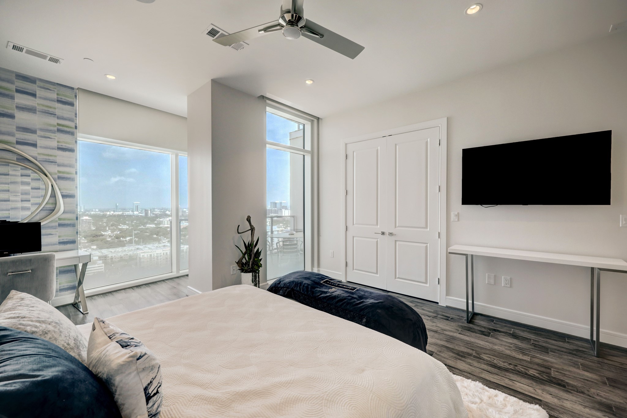 Another view of the spacious master bedroom with plenty of natural light and amazing views
