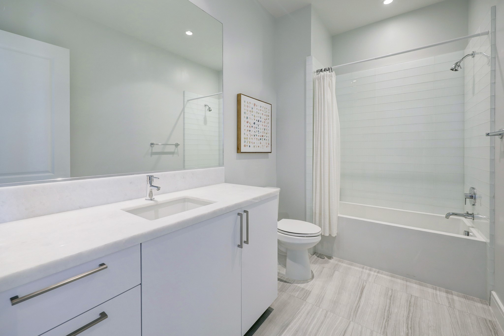 Secondary Bathroom features tile floors and a shower/tub combo