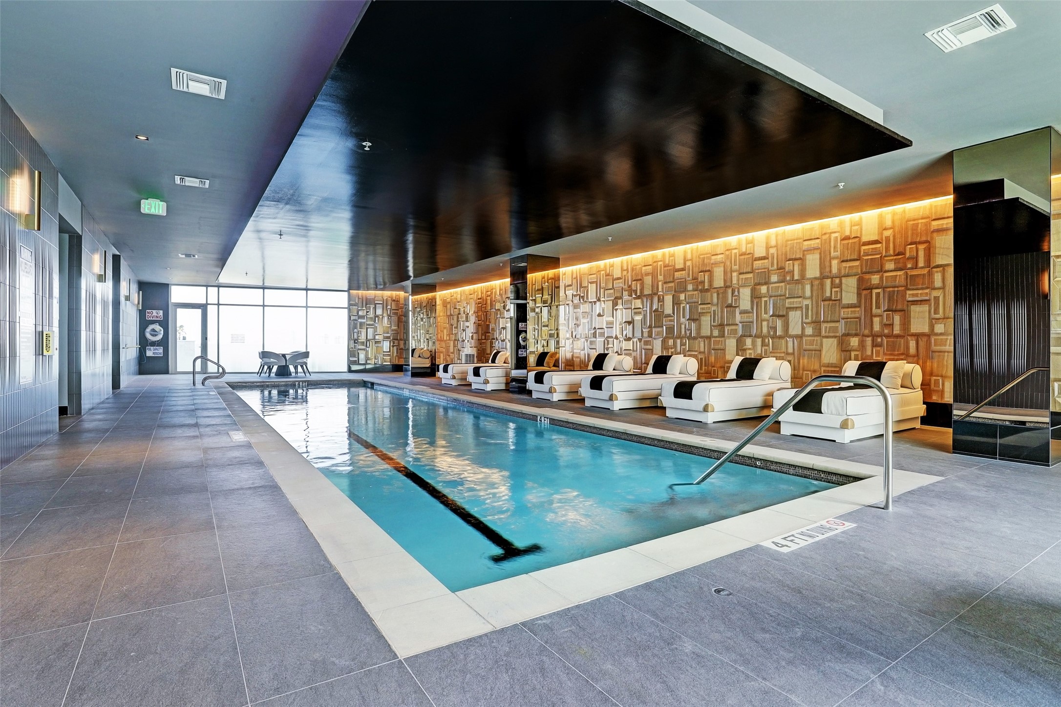 The spa-like indoor pool features walls of glass as well as easy access to a sauna, massage room and pet salon